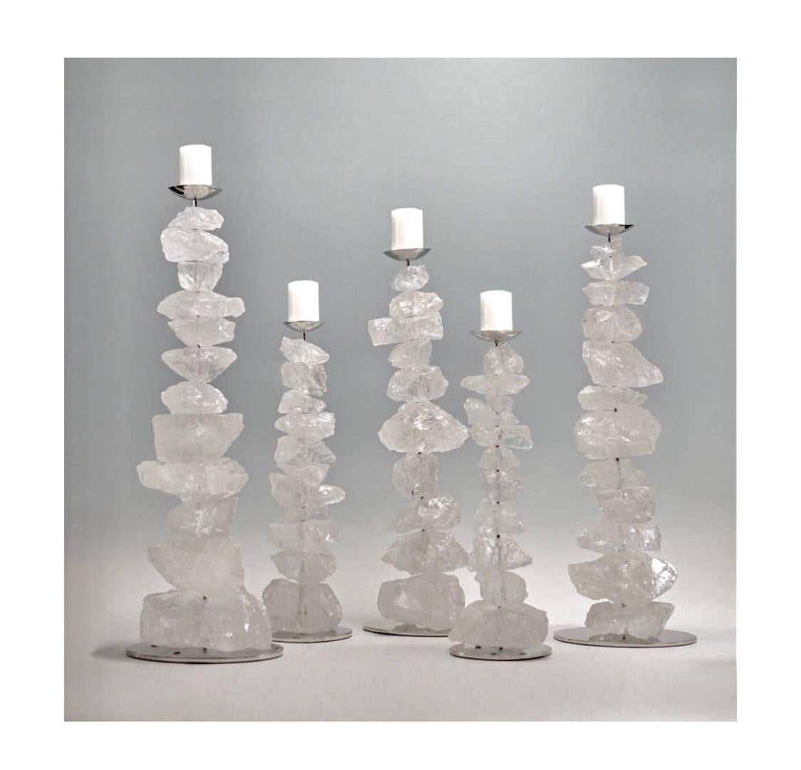 The natural stack of rock crystals mounted as candleholders with nickel-plated stands;
Size available in 17