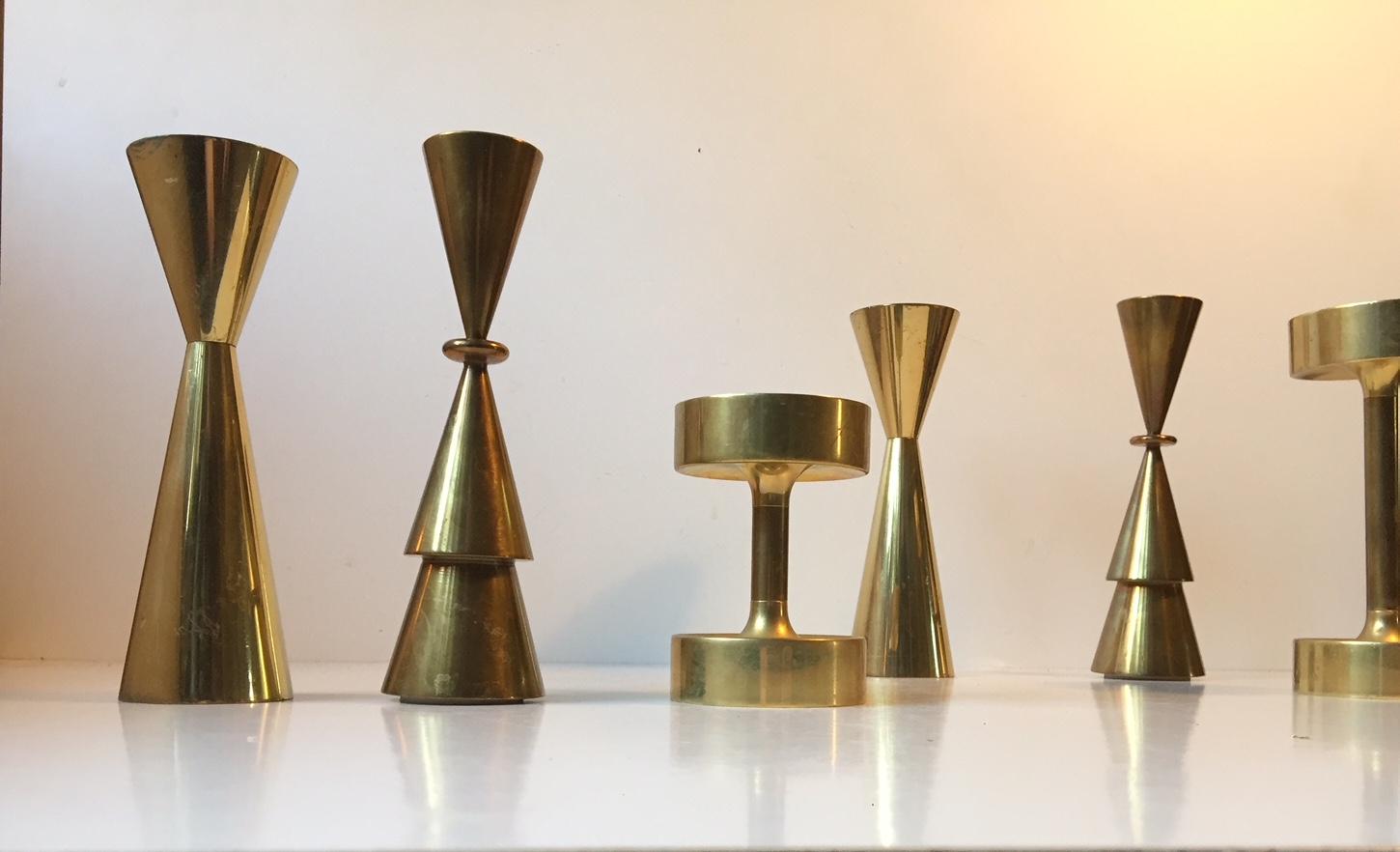 A group of 3 pairs Scandinavian candlesticks made of solid brass that has patinated slightly over the years. Manufactured by different makers in Sweden and Denmark during the 1960s and 1970s. The price is for the lot - all 6/3 pairs.