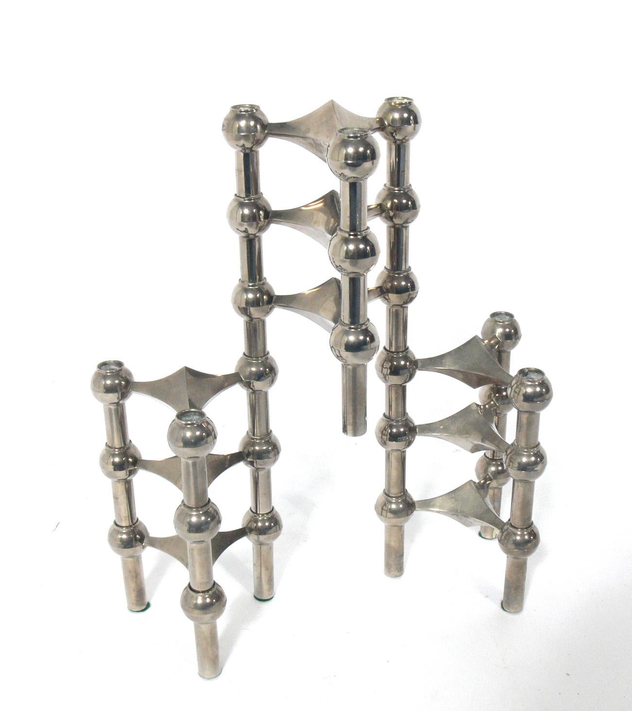 Group of sculptural interlocking candlesticks, designed by Ceasar Stoffi for Nagel AG, Germany, circa 1960s. This group includes nine individual candleholders, which can be used individually, or stacked in various configurations.
