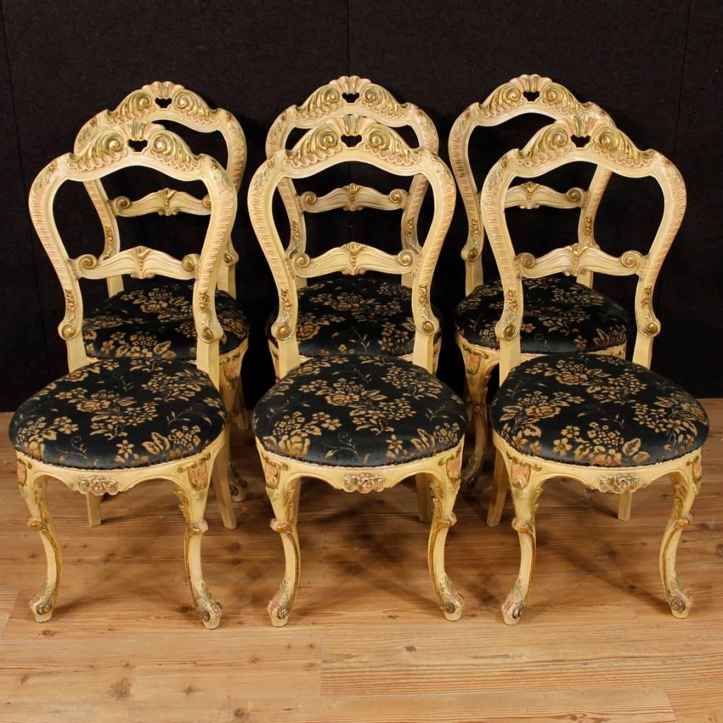 Group of six Venetian chairs from 20th century. Furniture in richly carved, gilded and lacquered wood and plaster with floral decorations. Chairs upholstered in velvet with floral decorations with some signs of wear and padding to be revised. Height