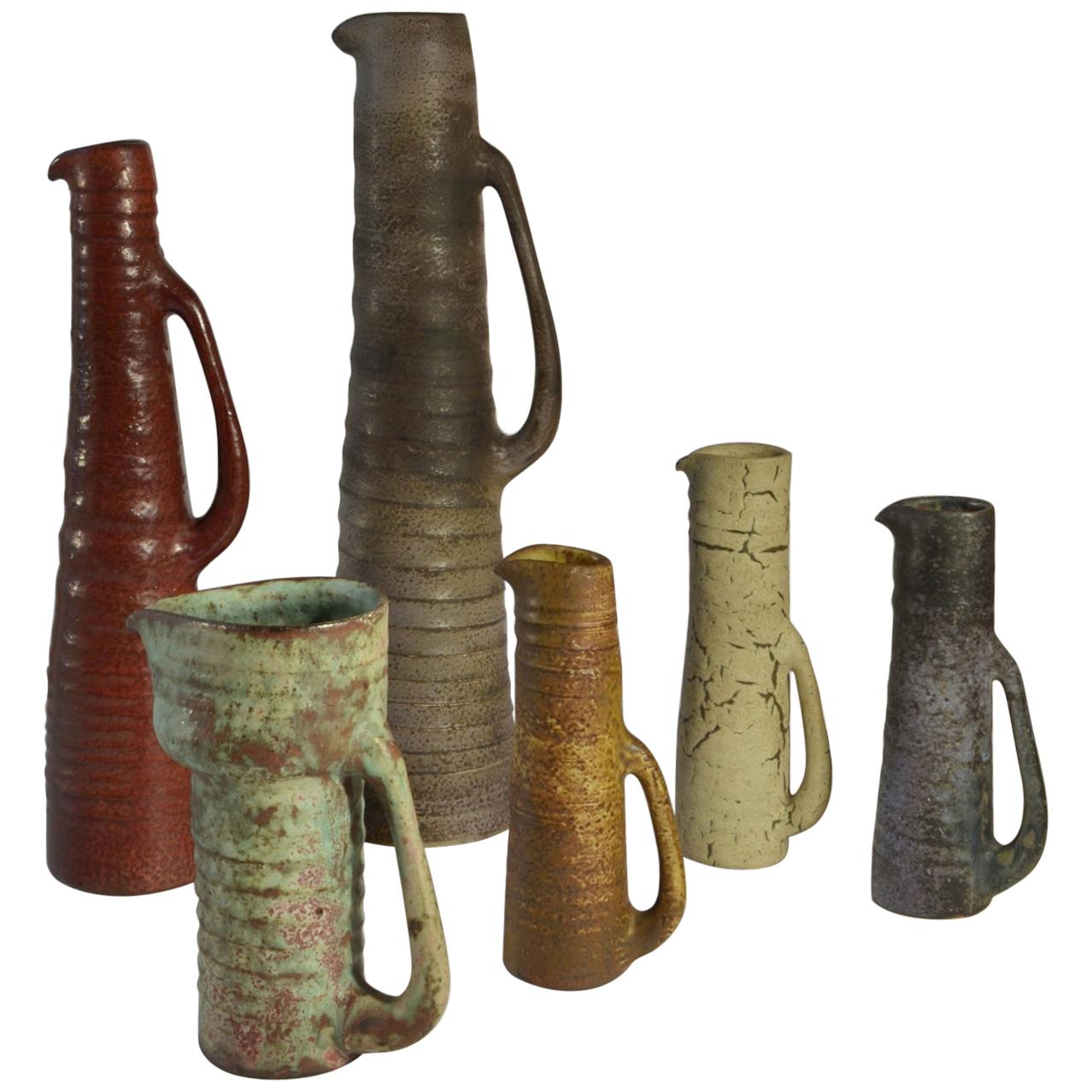 Group of Six Whimsical Mid Century Ceramic Studio Vases in Earth Tones
