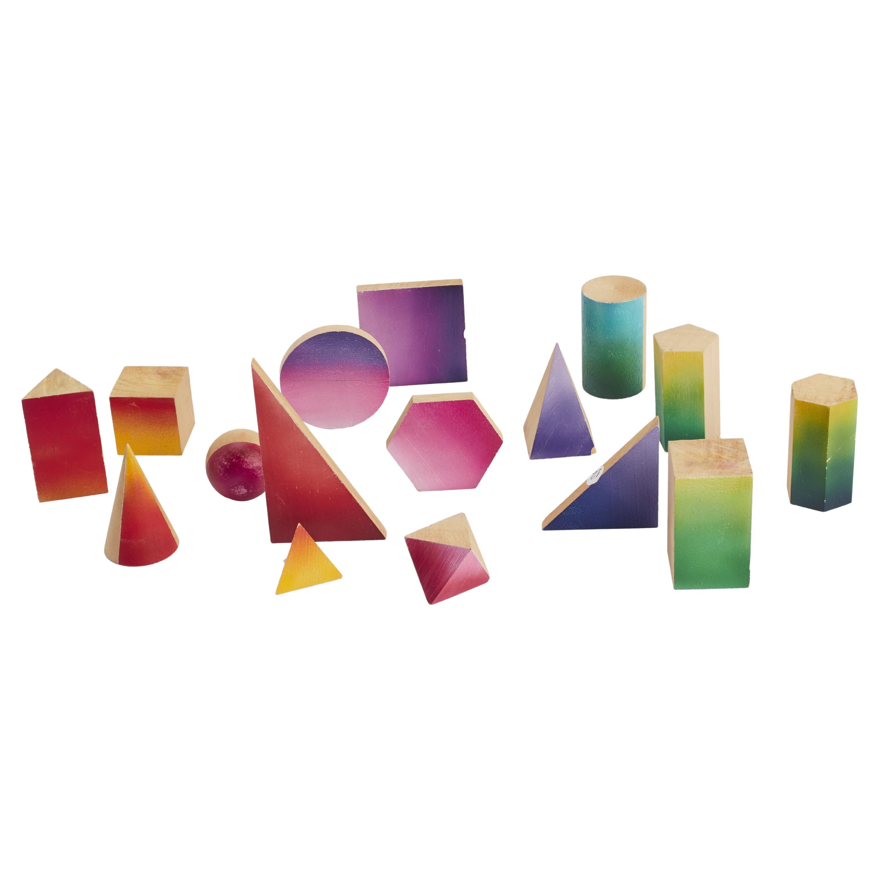 Group of small wooden geometric models with chromatic faces, Italy 1900.