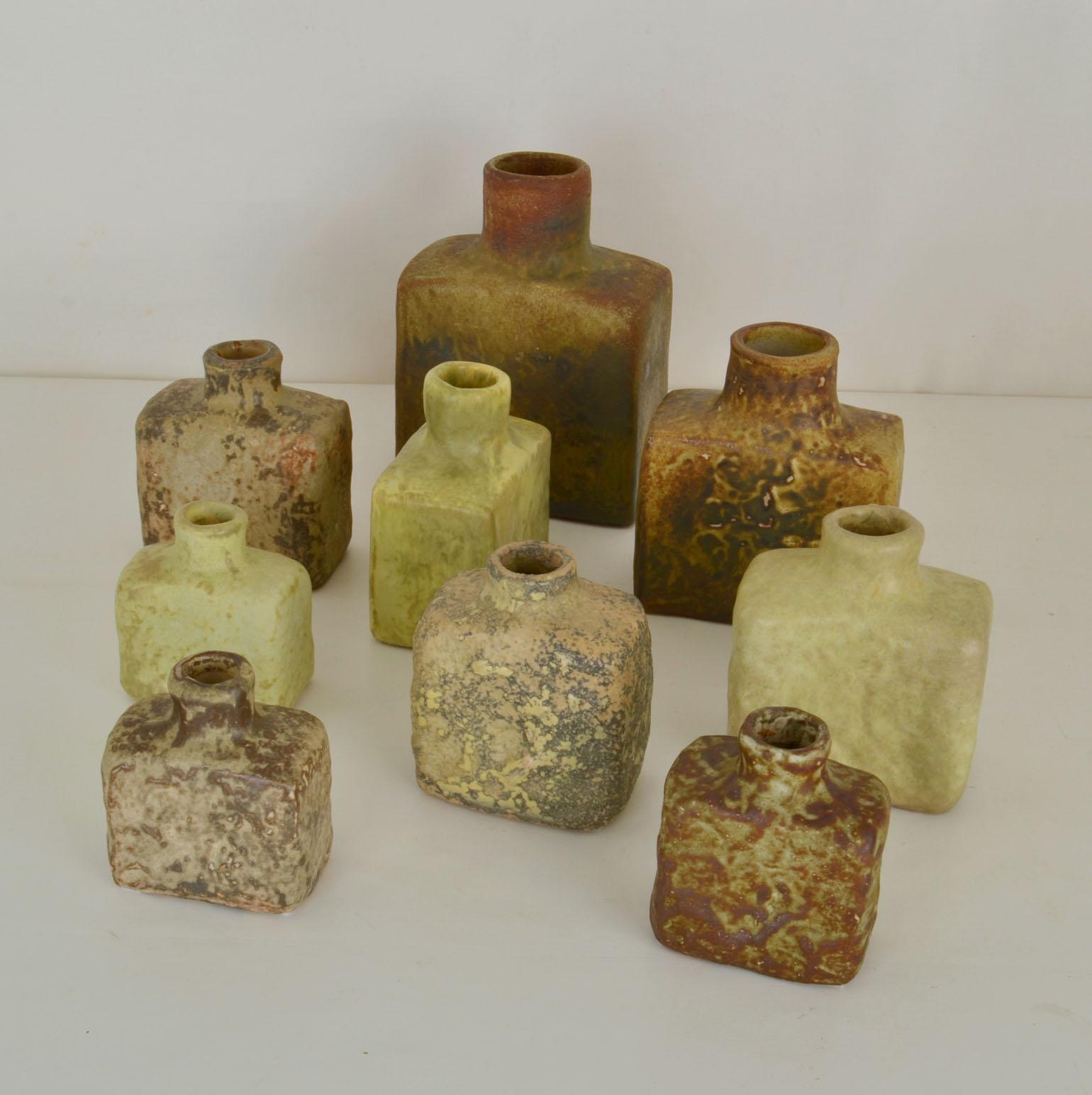 Mid-Century Modern square studio pottery vases glazed in grey-green natural tones hand formed and in various heights by Mobach's Dutch ceramist in the 1960's. The glazes made of natural resources are highly influenced by leading English Potter