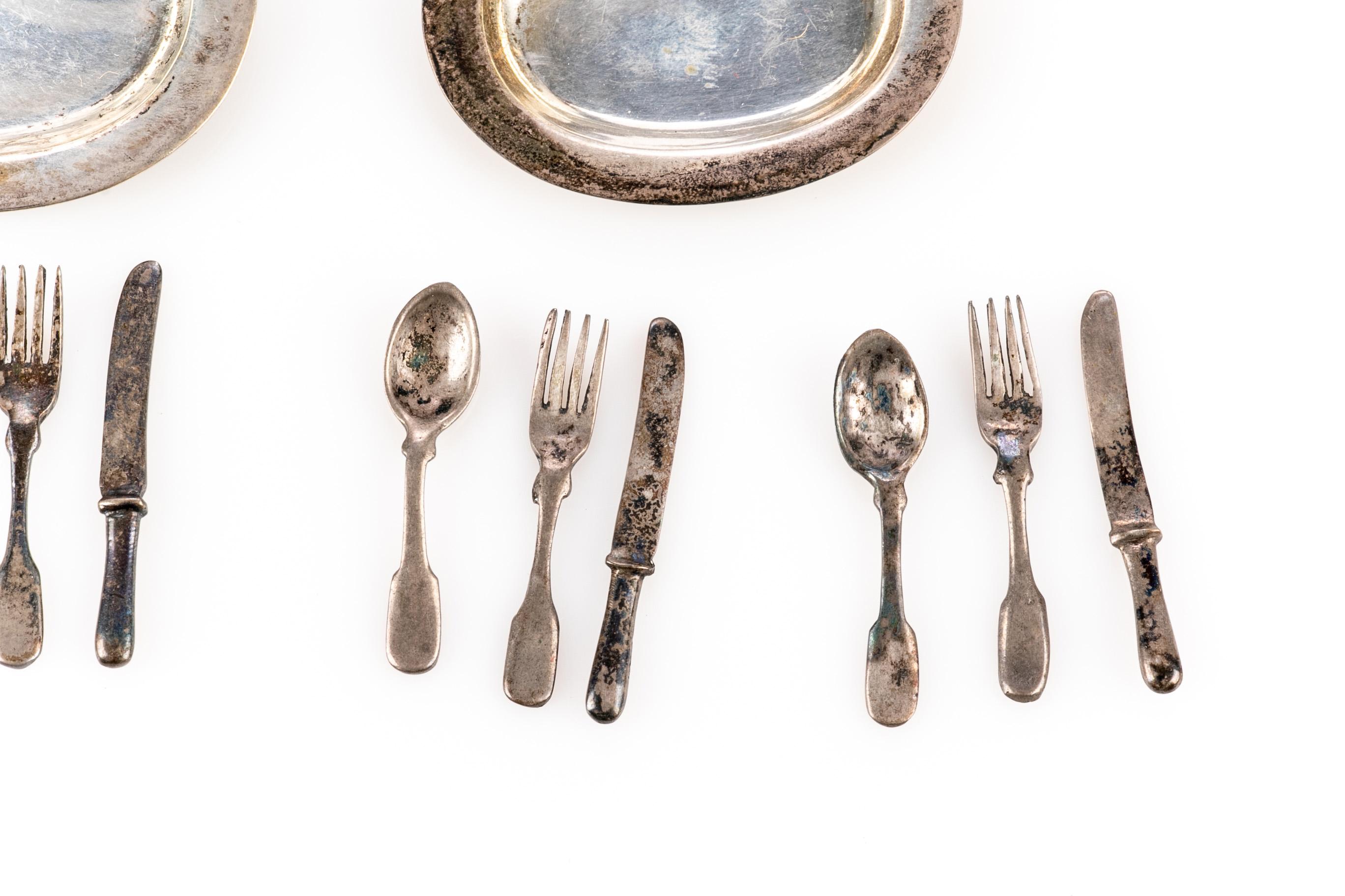 Group of thirty English sterling silver dollhouse miniature serving pieces and utensils including trays; tea and coffeepots; candelabras; a pedestal bowl, flatware and other unique pieces. Most are marked 