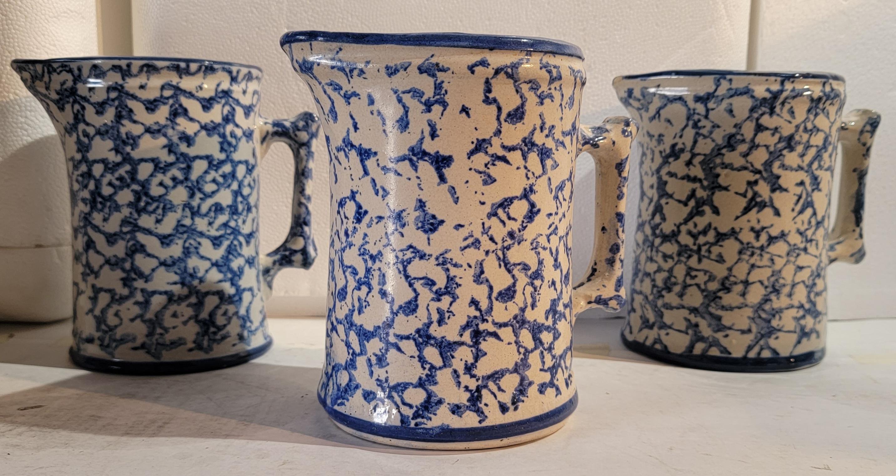 19th C Blue & white sponge ware pottery pitchers in good condition. These hard to find pottery pitchers are in different shades of blues. Sold as a group of three.