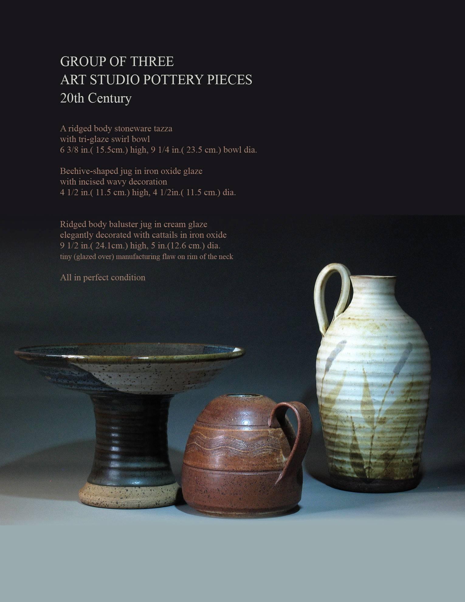 Group of three Art Studio pottery pieces 20th century,
1st- A ridged body stoneware tazza with tri-glaze swirl bowl, measures 6 3/8