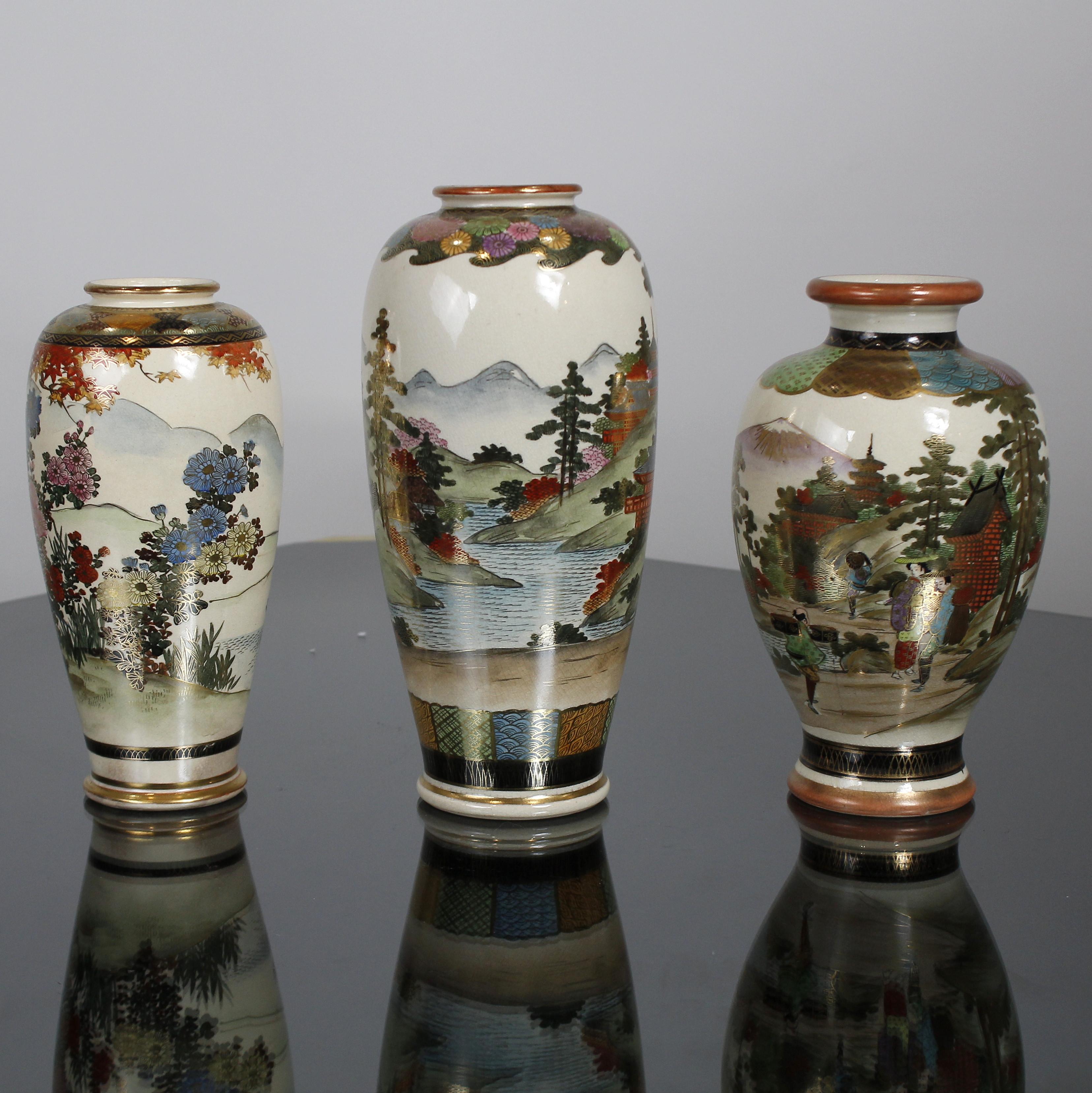 Group of three early 20th century Japanese Satsuma period vases finely painted in gold and polychrome enamels, circa 1900.

Measurement units:

Vase on the left (photo):
Diameter 10 cm, height 22 cm
Diameter 3.9 inch, height 8.6 inch

Vase