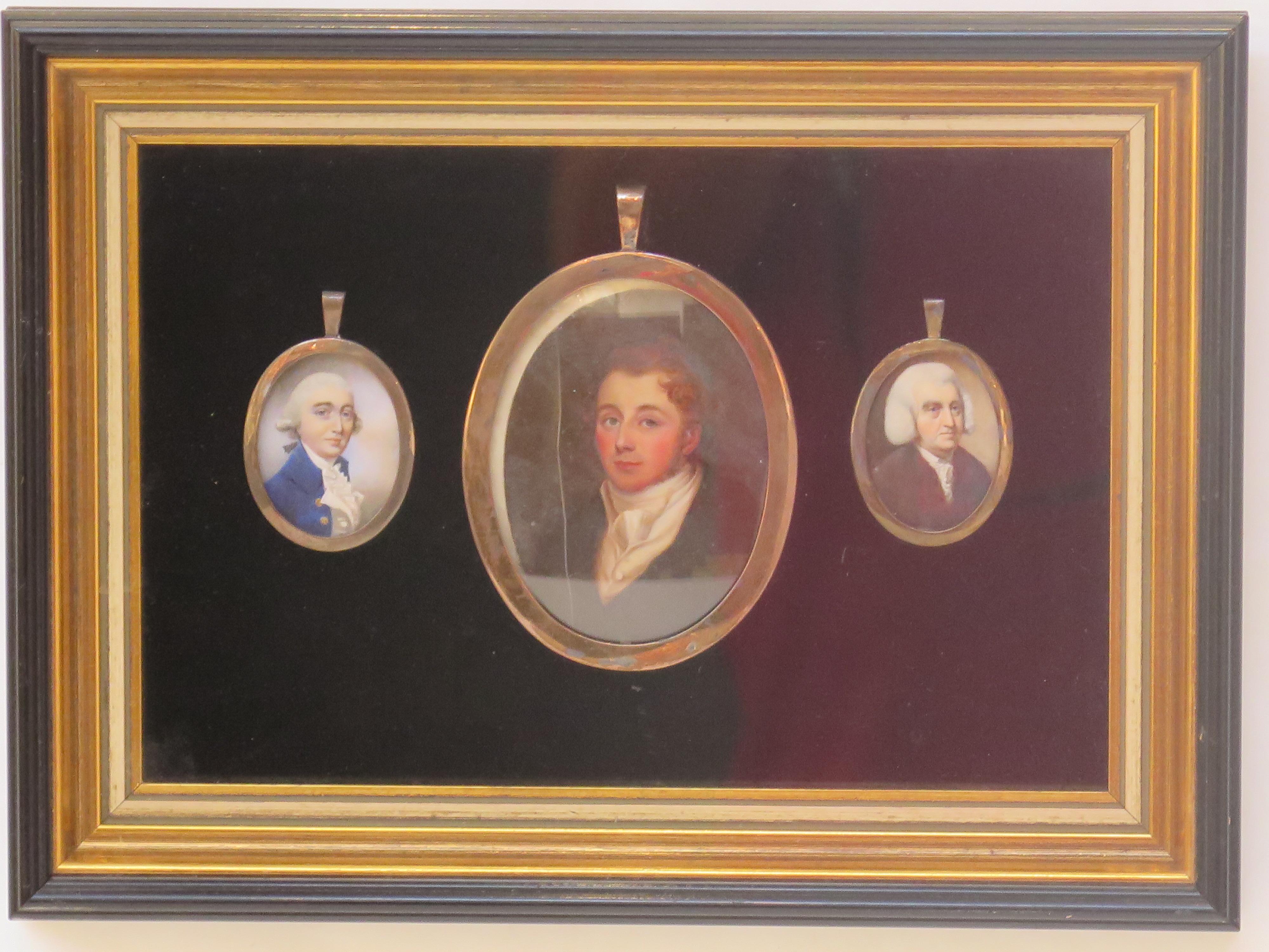 a group or collection of three miniature portrait paintings of gentlemen, framed together, the central larger picture, English Regency, shows a younger man with brown hair dressed in a style popular at that time, the other small ovals depict white