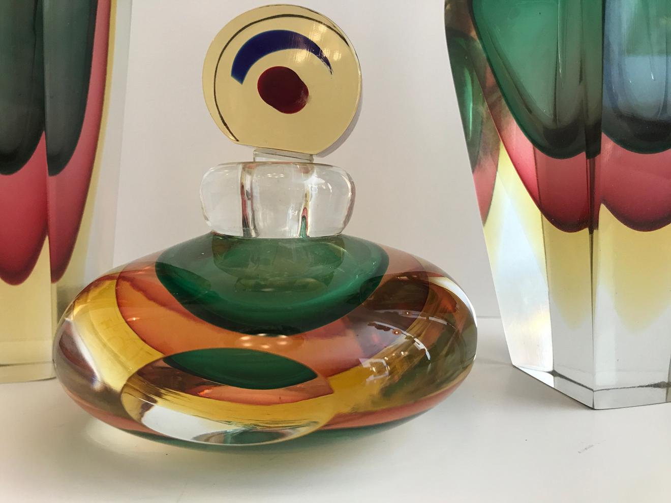 Group of three Murano glass perfume bottles. Very thick glass and great colors.
Measures: 11
