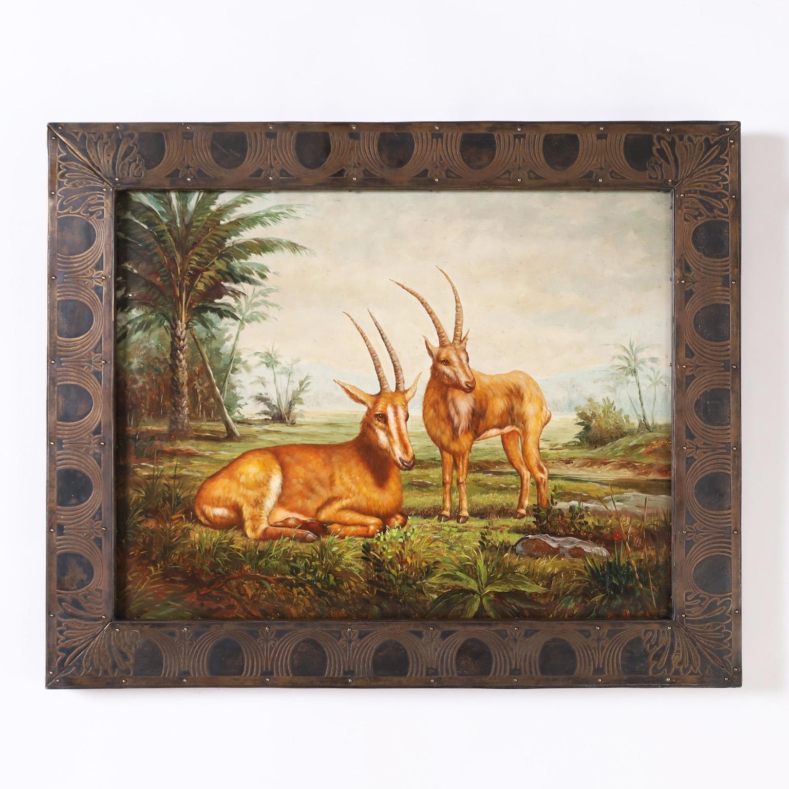 Group of three oil paintings on board of African animals such as antelopes, elephants, and lions in tropical settings. Presented in bronze frames with embossed designs. Tagged Maitland-Smith on the backs. Priced individually.