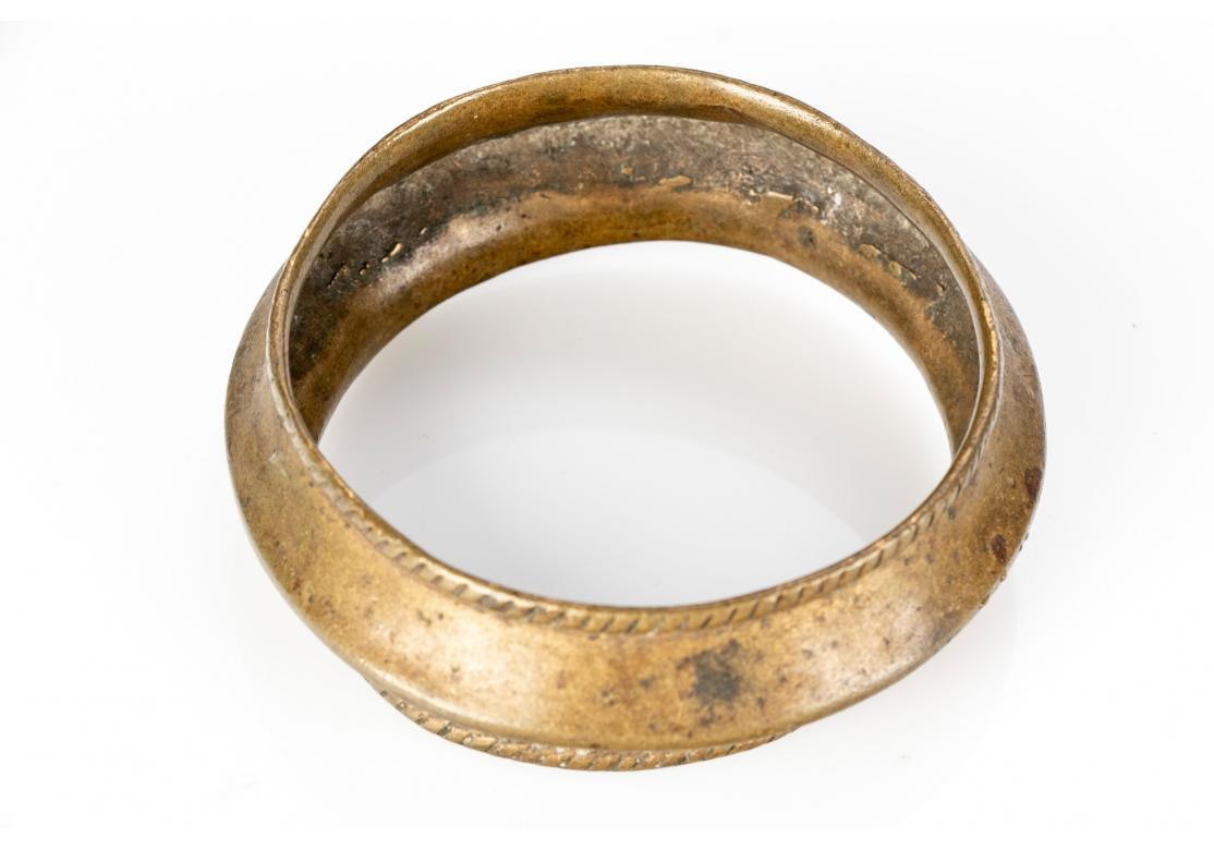 From the Collection of noted Multidisciplinary Artist Norma Flanagan. A very Sculptural and well-crafted Brass and Bronze Bracelets. Collected in the 1960’s and all having an excellent age patina. The largest Bracelet, in bronze, with Flaring sides