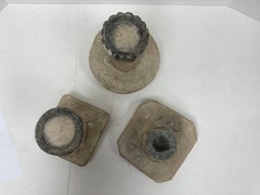 Group of Three Primitive Style Cast Stone Candle Lamps