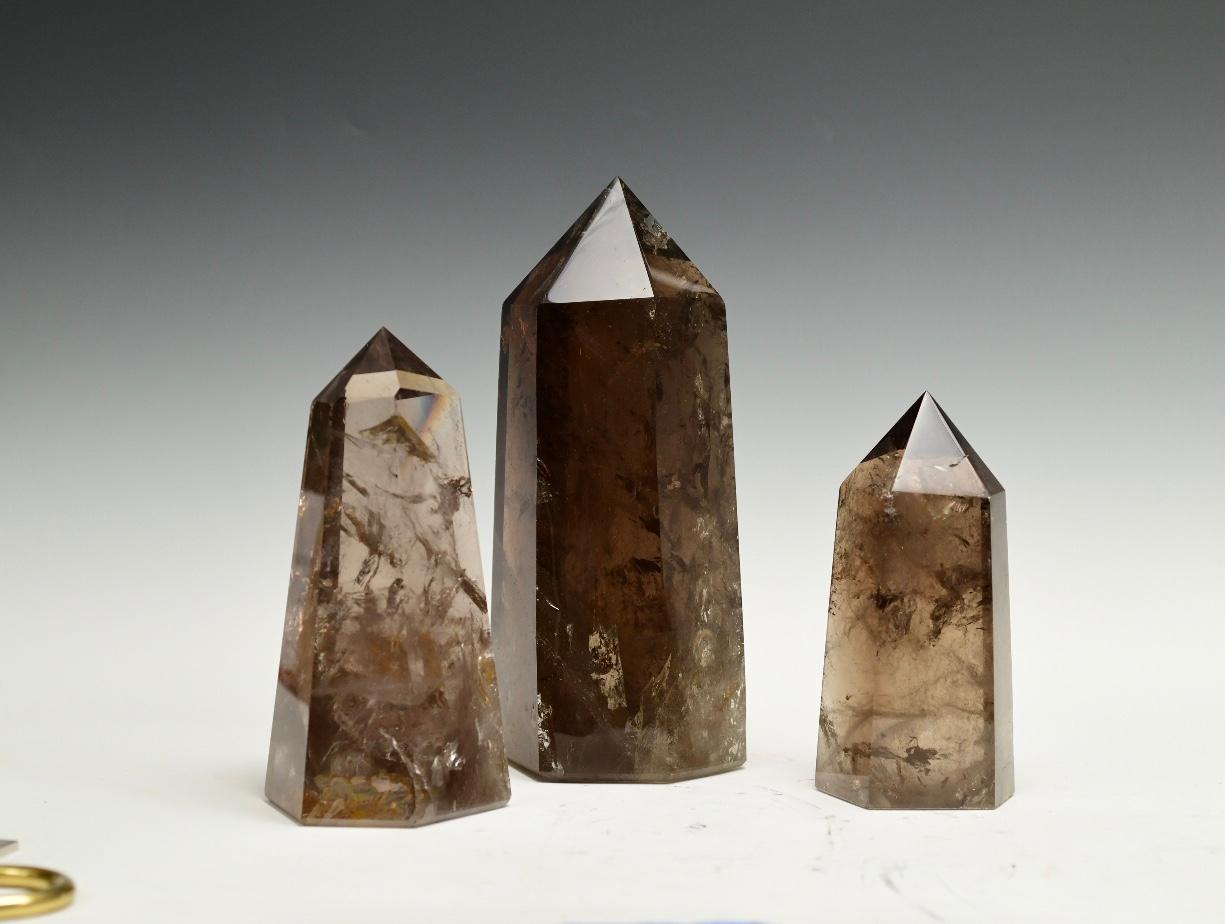 Group of three superb quality smoky rock crystal obelisks.
Measures: 9.5 /H x 5 x 4.5
8.25 /H x 4 x 3
13 /H x 6 x 5.5.