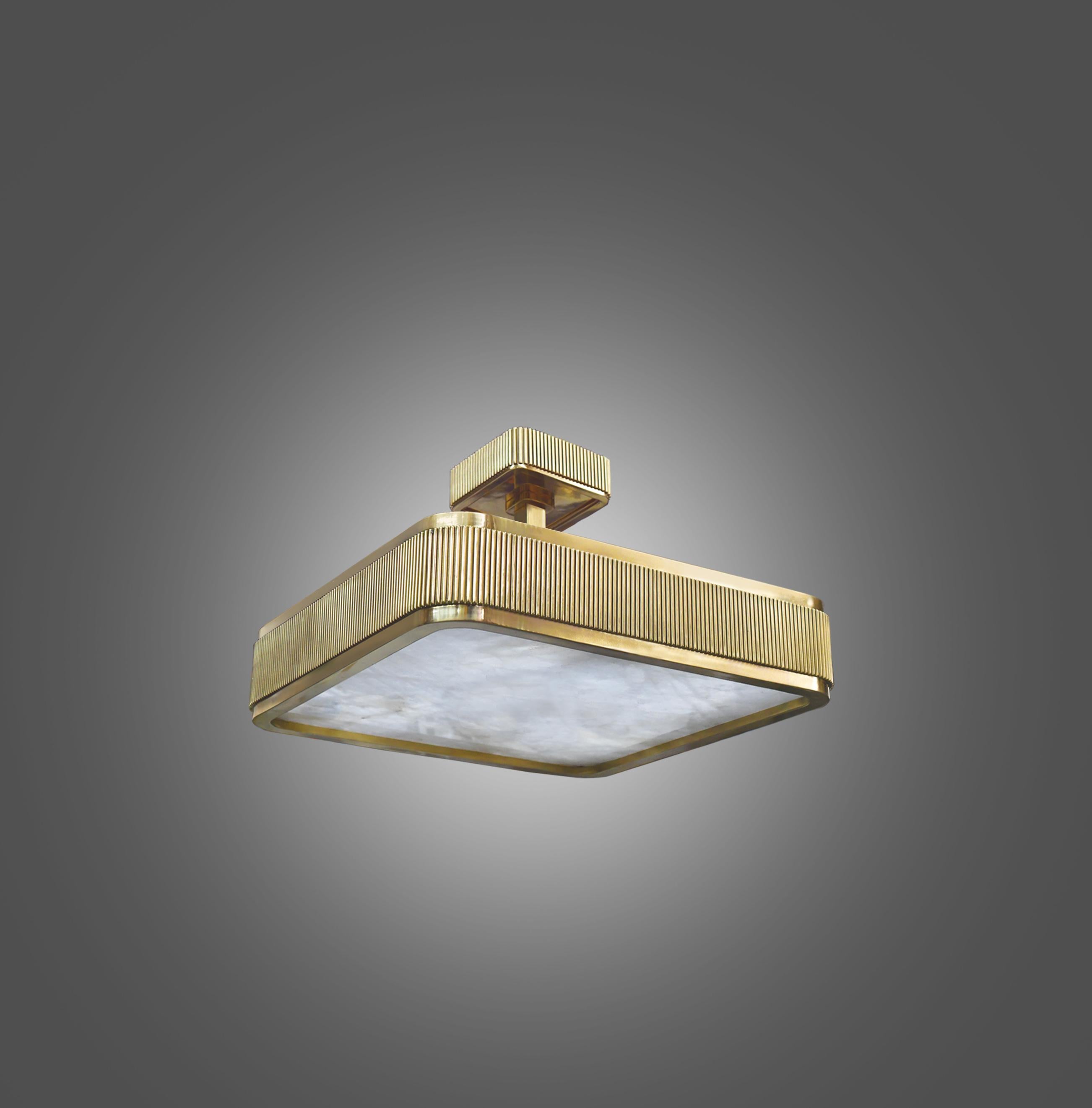 Group of two elegant form polished brass frame with rock crystal panel, BSO rock crystal semi flush mount created by Phoenix, NYC.

Height can be adjustable.

Lutron dimmer system. 
Each fixture installs four E26 base sockets. 
Use four 60W