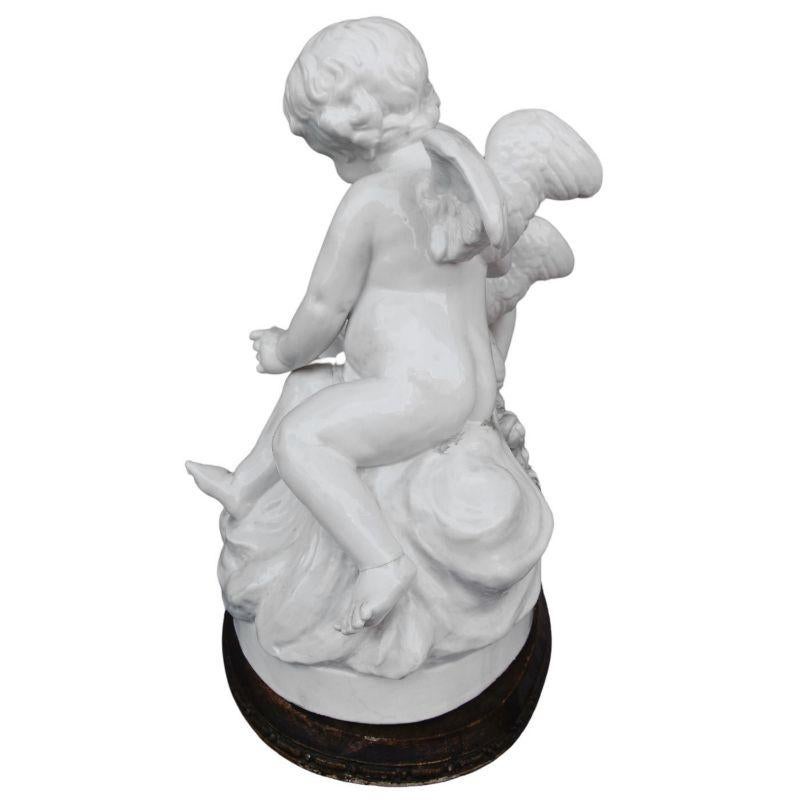 Group of Two Cherubs Around a Late 19th Century Porcelain Basket For Sale 1
