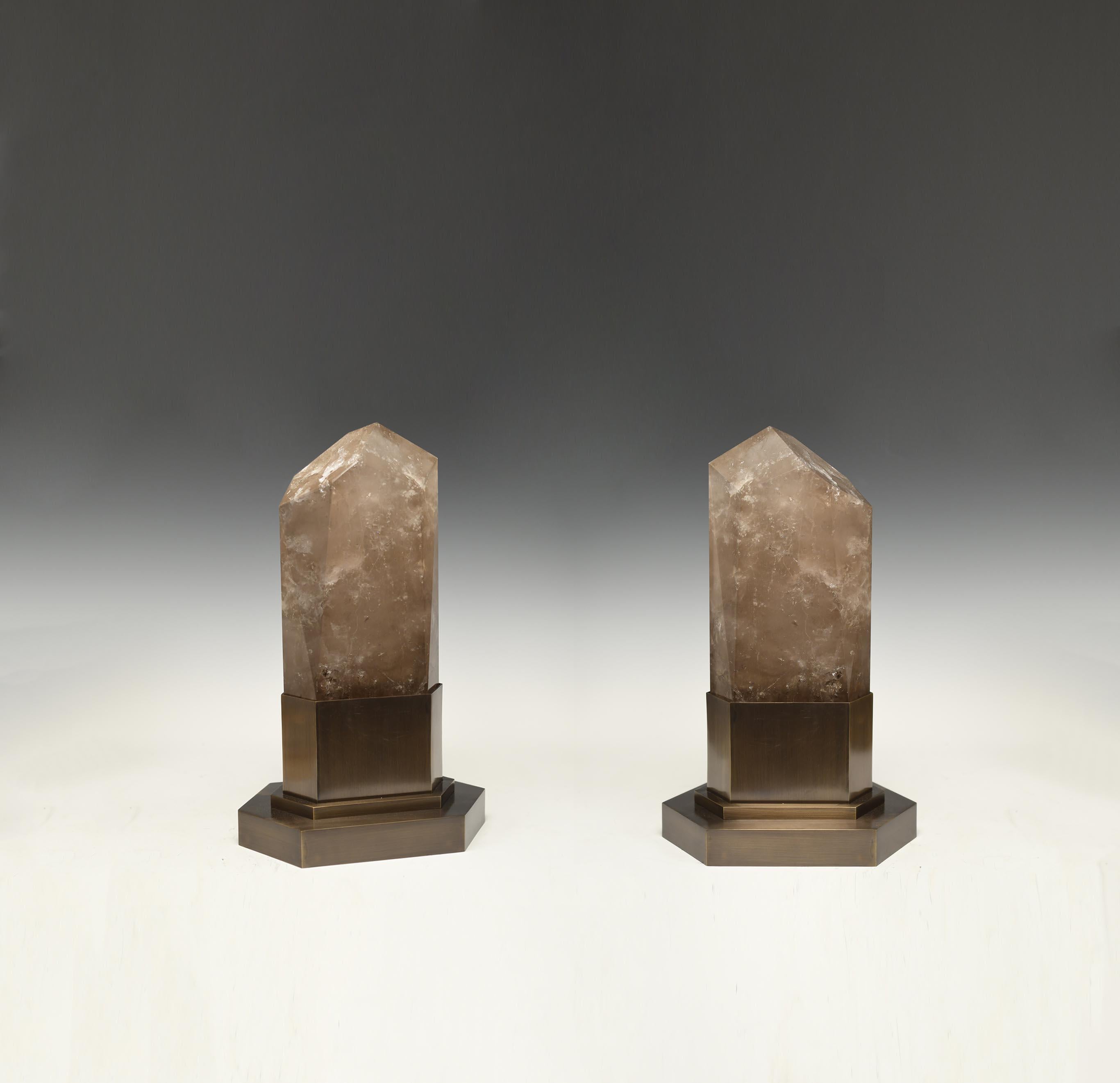 A pair of smoky rock crystal obelisk lights with antique brass bases. Created by Phoenix Gallery, NYC. 
Two sockets installed. Supply two led warm lights. 120w max.
Custom size available.