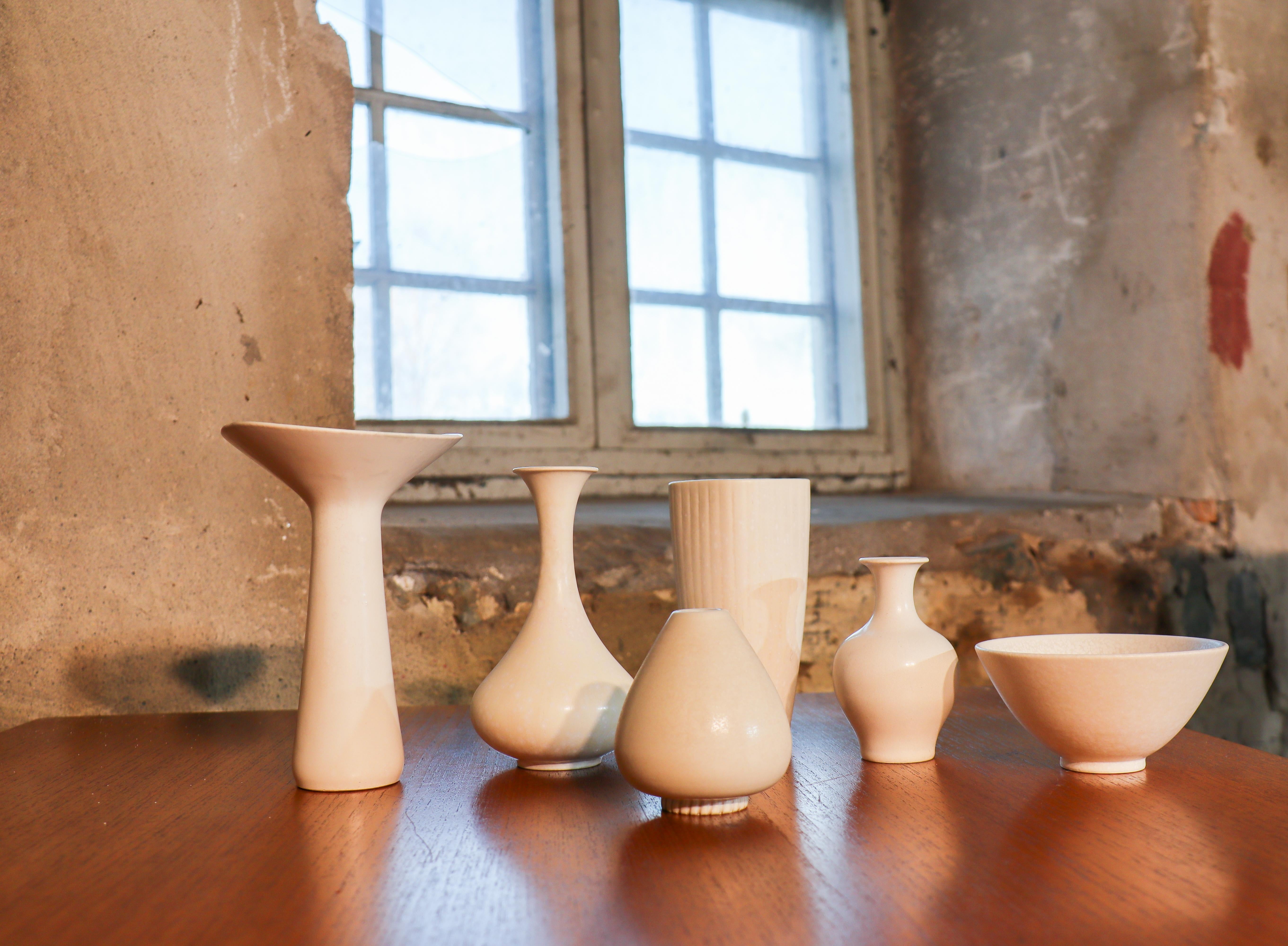 A group of six pieces of stoneware vases & one bowl with stunning white glazes designed by Gunnar Nylund and Carl-Harry Stålhane at Rörstrand in the 1950s. The vases are between  9 - 18 cm tall and in excellent condition except from some slightly