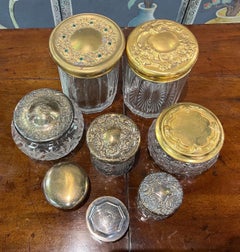 Grouping of 8 Cut Glass Jars with Sterling and Brass Lids