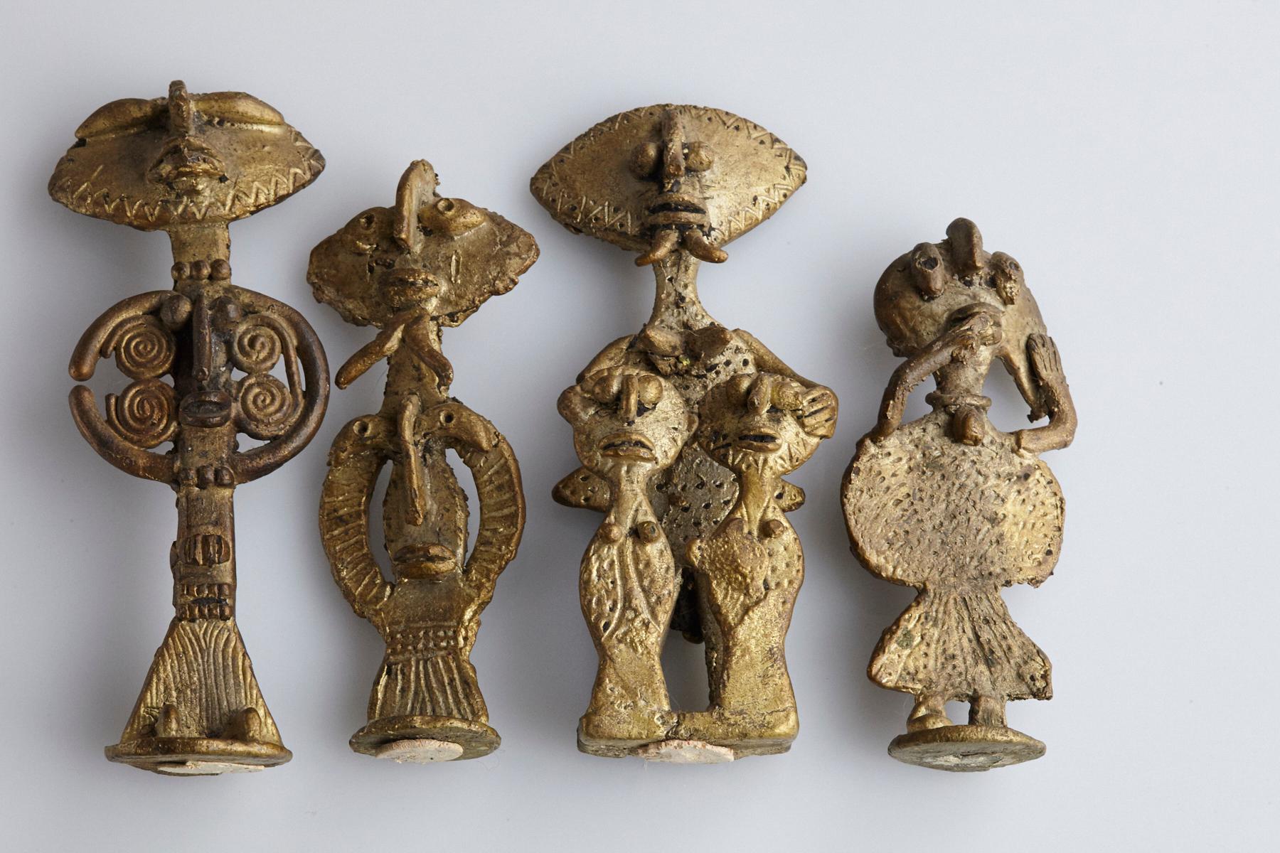 Grouping of Akan Ashanti cast bronze figurines. The Ashanti or Asante People from Ghana have a rich tradition of crafting bronze pieces to commemorate important figures from their culture or people from their tribe or family. 
The figurines are