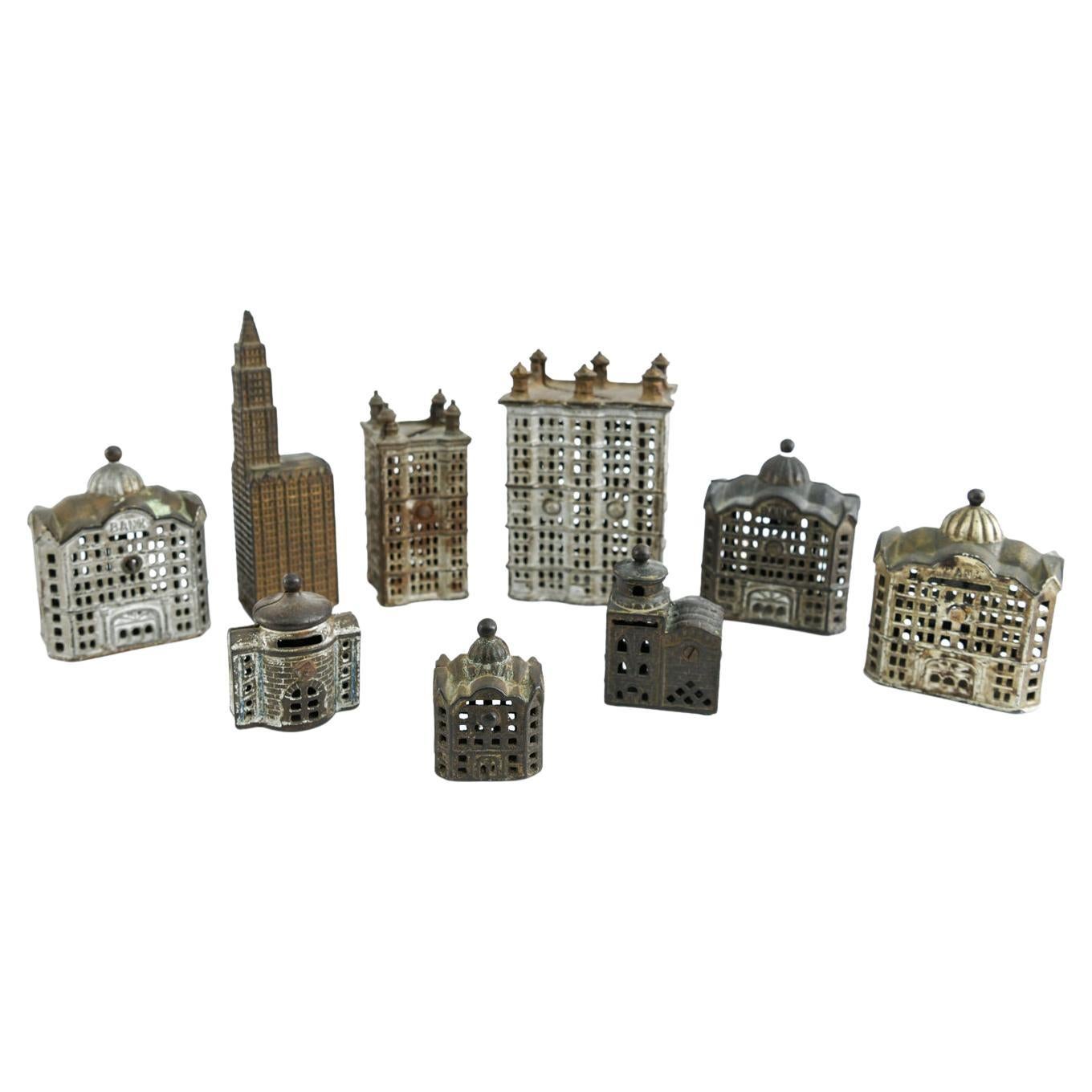 Grouping of Cast Iron Miniature Buildings For Sale