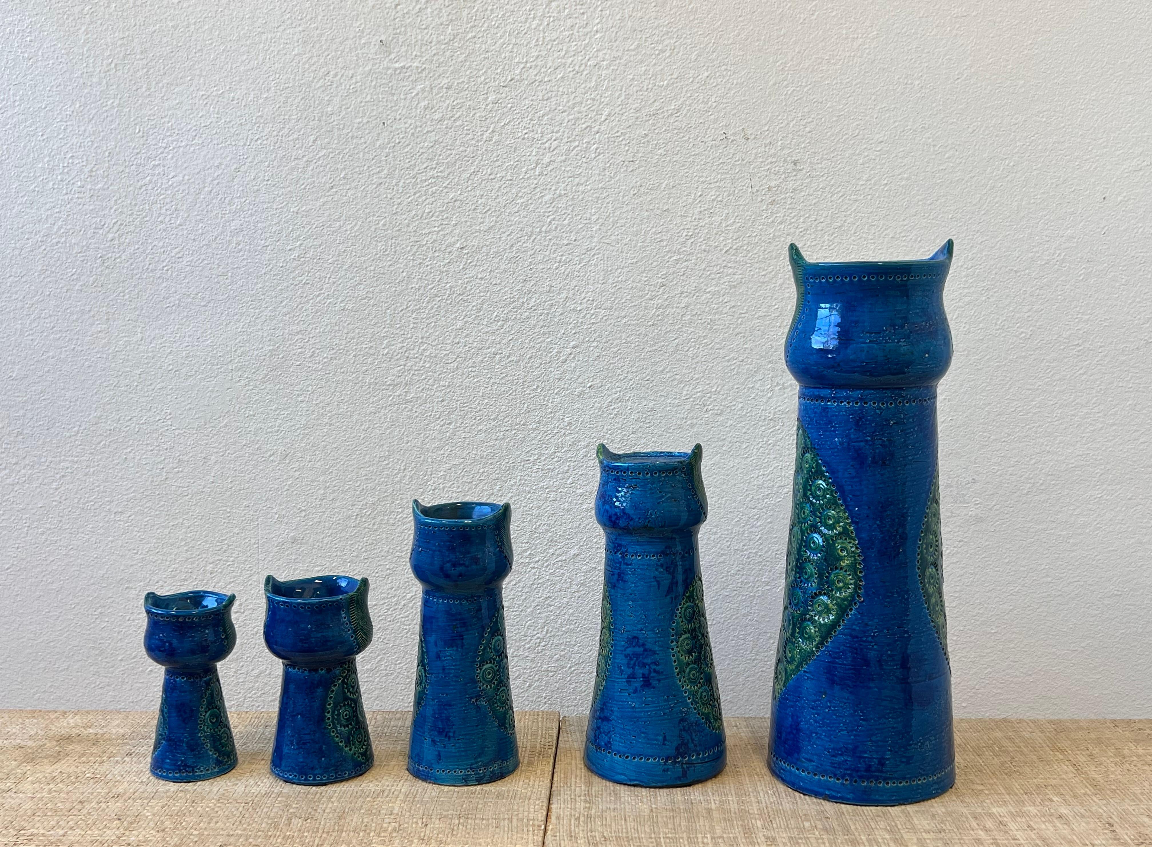 1960’s Rare grouping of five Italian “ Rimini Blue” ceramic owls by Aldo Londi for Bitossi. 
They are in beautiful vintage condition. The grouping consist of three vases and two candleholders. 

The tallest is 19.75” High, 7” Diameter, the smaller