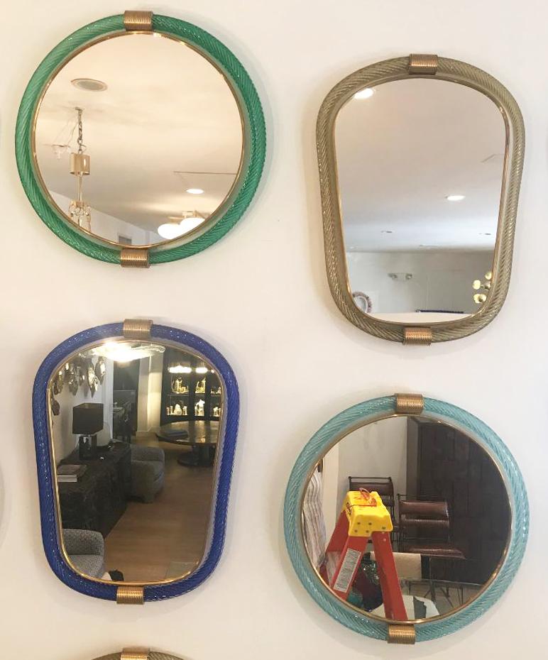 Absolutely rare collection of 15 Barovier & Toso wall mirrors. Two different shapes and five different colors (see images). Brass details, stamped on the back Barovier e Toso. Amazing wall installation.
Can be sold individually or as multiple. Size