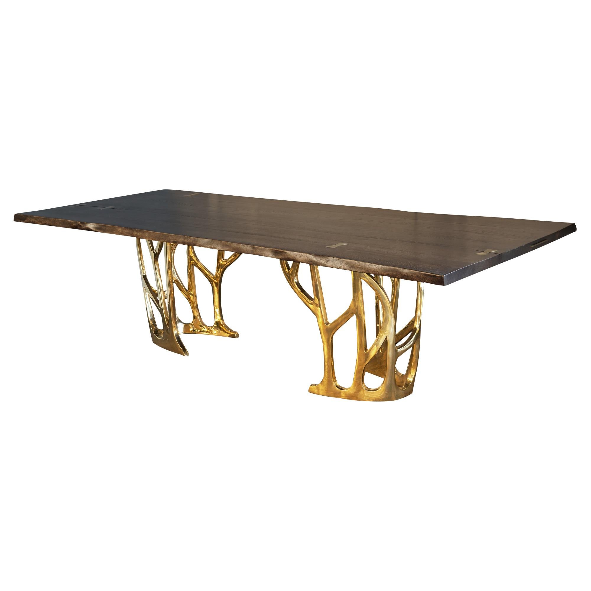 Dining table with cast bronze base and live edge hardwood, stone, concrete or glass top.
Can be custom sized and finished.