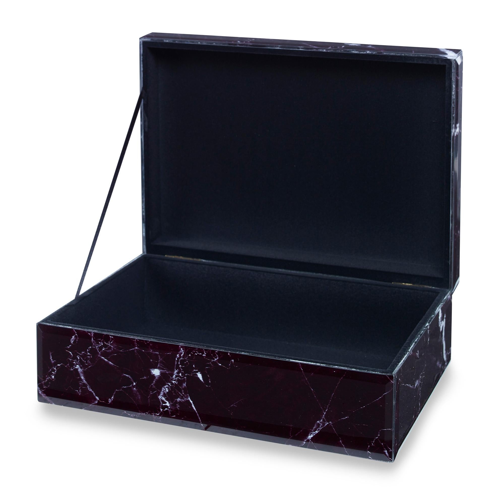 A hinged box featuring a glass facade finished to resemble black marble with white veining.
 