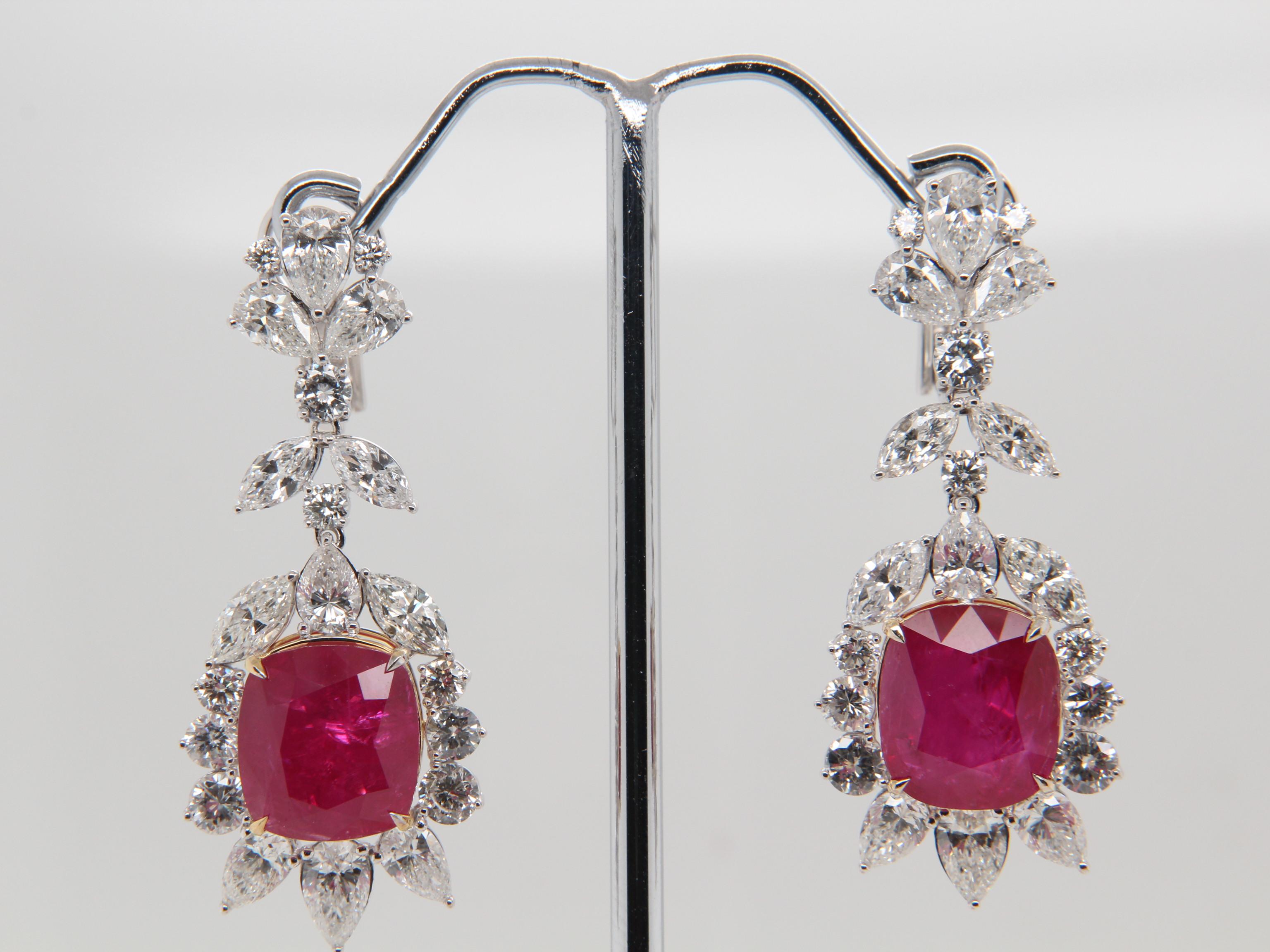 A brand new handcrafted ruby earring by Rewa Jewels. The earring’s center stones weigh 13.55ct and 1.32ct, are of Burmese origin and certified by Gubelin Gem Lab as natural, unheated, 'Red' with certificate number 21091144. The centre rubies have