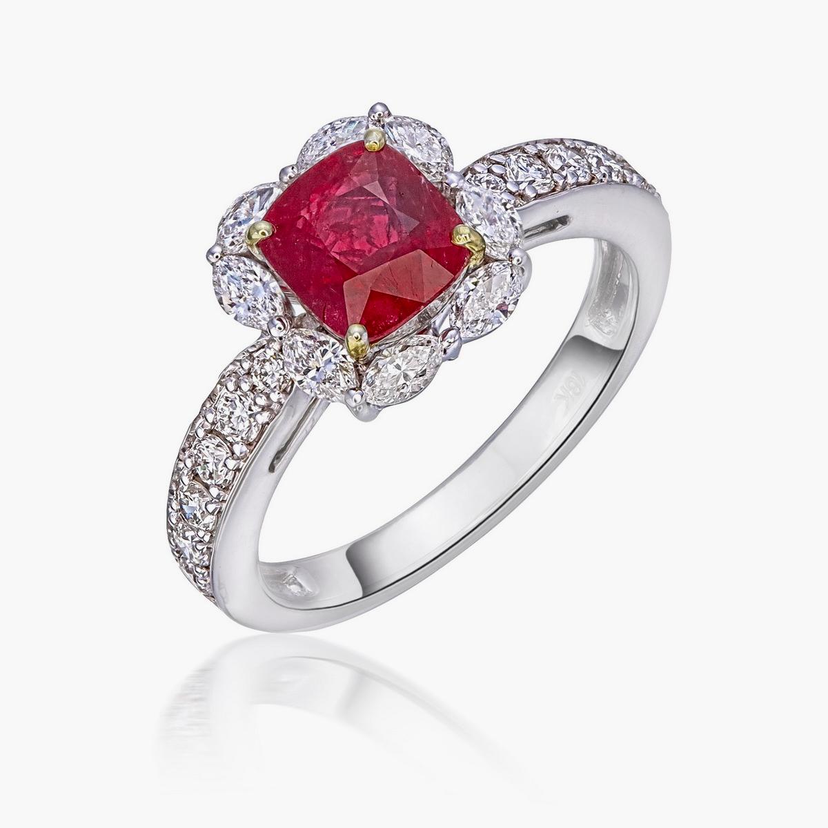 A ‘Pigeon Blood’ red hue ruby and diamond solitaire ring made in 18 Karat gold. A classic design that is a good fit for everyday use and for special occasions.  

    The center stone is a cushion shaped 1.43 carat GRS certified ‘Pigeon Blood’ red