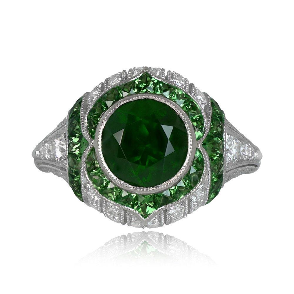 This exquisite gemstone ring showcases a certified 2.07-carat Natural Dementoid Garnet, validated by GRS, and untouched by heat treatment. The central gem is encircled by a halo of French-cut natural Tsavorite garnets. The ring's design is further