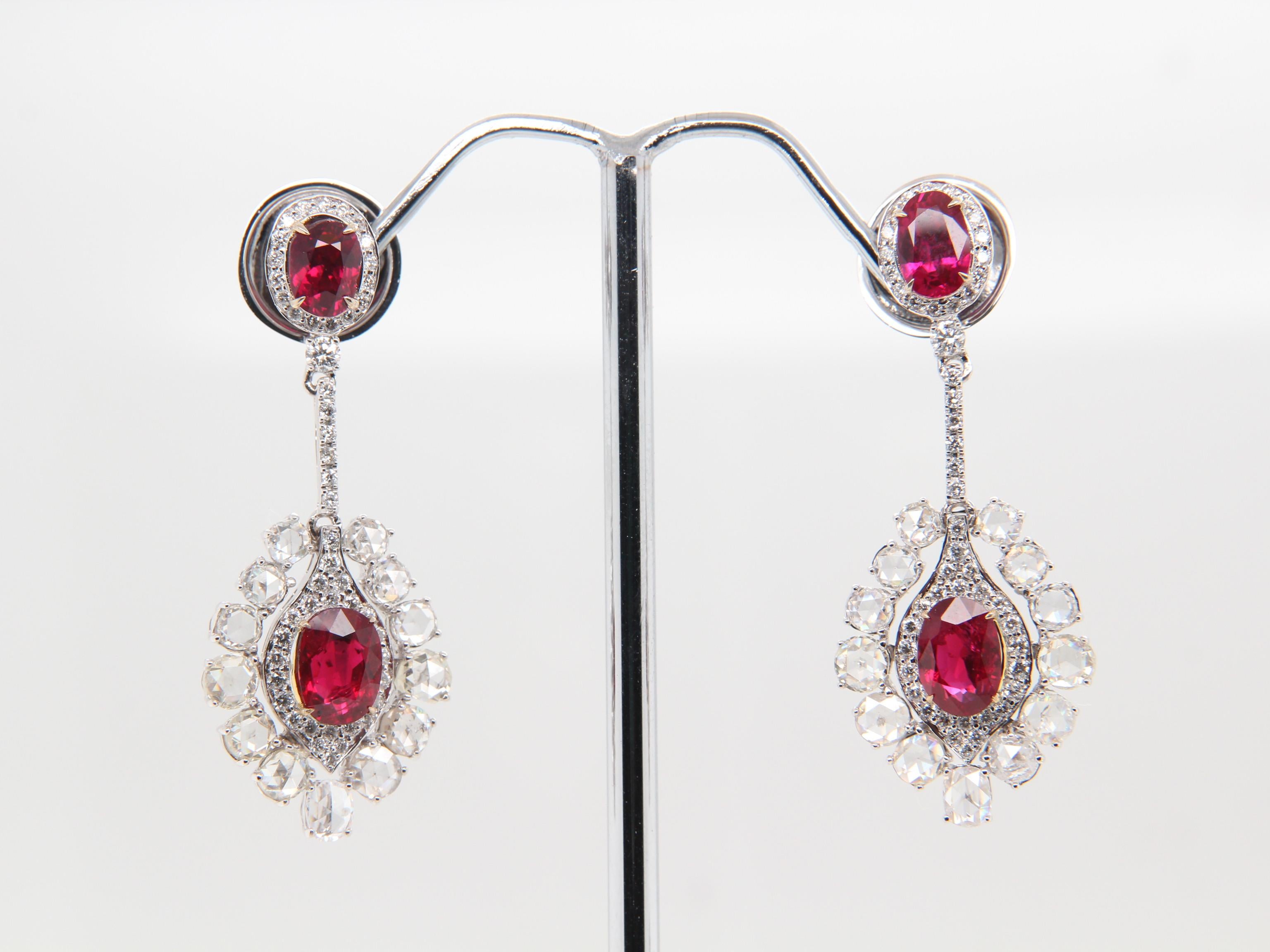A fiery pair of rare Burmese ruby and diamond earrings. The lustrous rubies' vivid and vibrant colours showcases why Burmese rubies are the best. This rare piece will not only help to exude confidence and importance, it also sets you apart from the