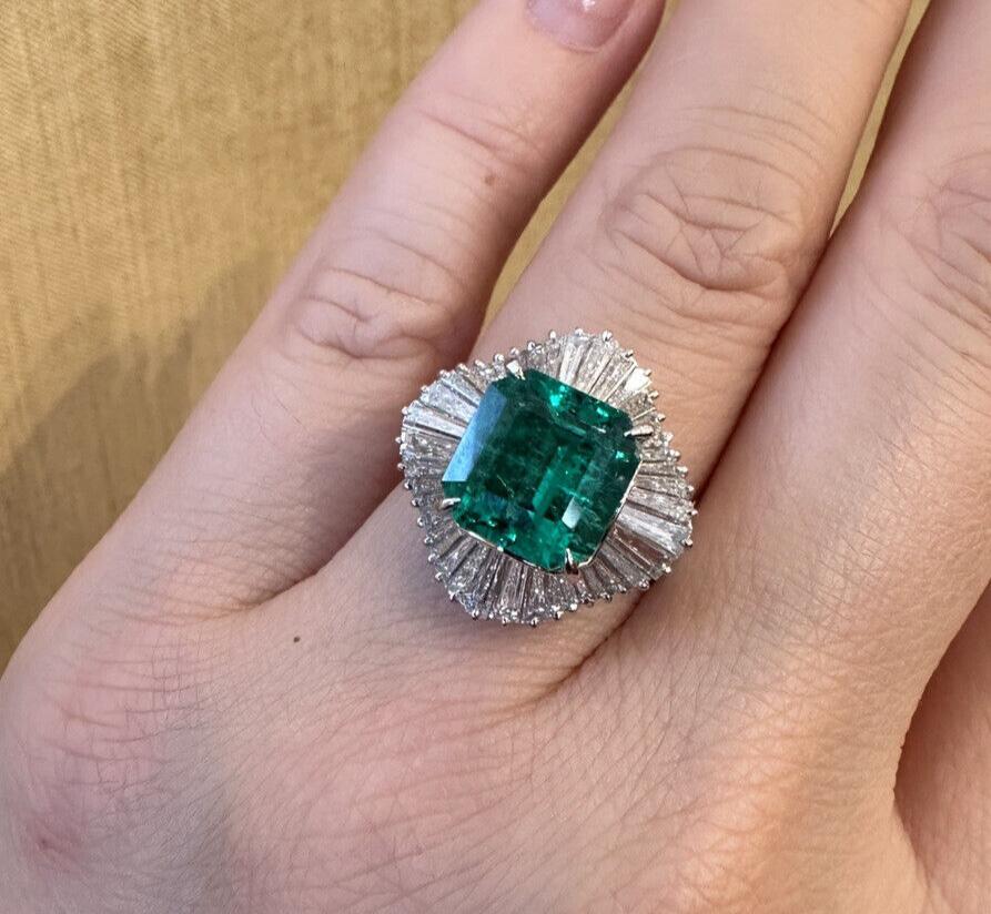 GRS Certified 3.39 Carat Colombian Emerald Ballerina Diamond Cocktail Ring in Platinum 

Emerald and Diamond Ring features a large Natural Emerald cut Emerald with Tapered Baguette Diamonds in Ballerina style with a Platinum setting. The Emerald is