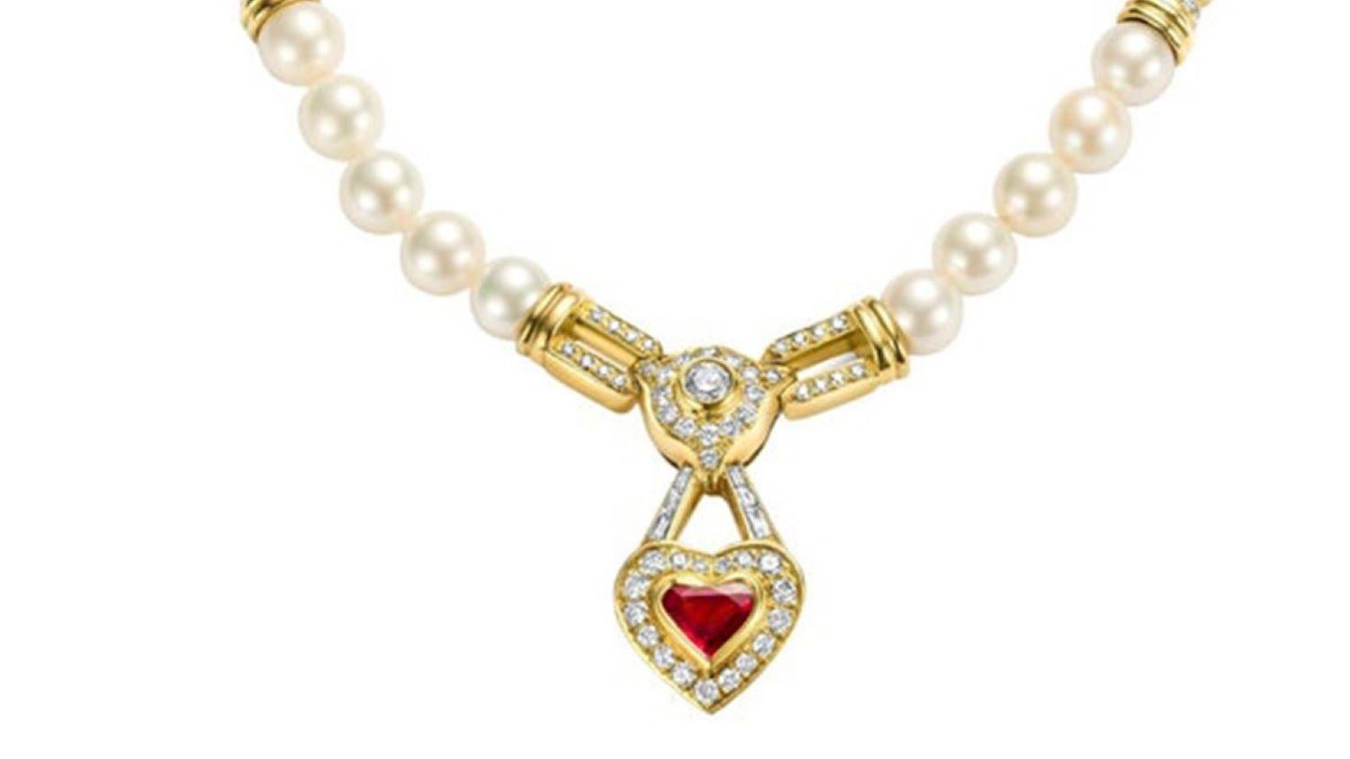 Gorgeous 18 kt. Yellow gold Pearl Necklace with Diamonds & Heart Shaped Red Ruby

Pearls: 38 Akoya pearls, diameter each pearl 8 mm

Ruby: Heart shape ruby, 
18 Square cut ruby

Diamonds: brilliant cut diamonds together 2.15 ct.
baguette cut