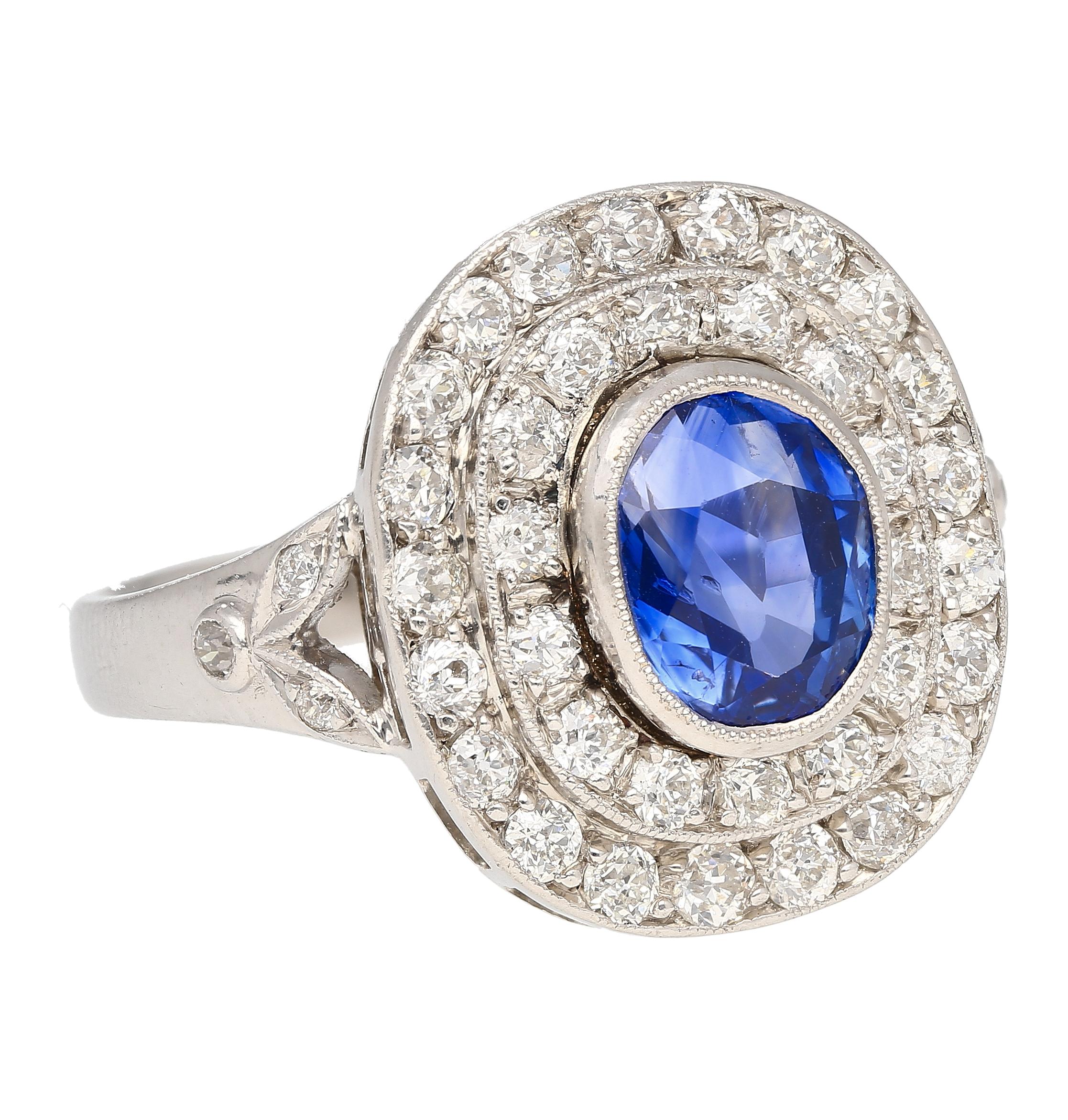 GRS certified no heat 2.56 carat Kashmir Blue Sapphire with double diamond halo ring. Mounted in a vintage bezel set platinum setting. The Blue Sapphire is superbly clean, with a legendary origin and no heat treatment of any kind. A true gem worthy