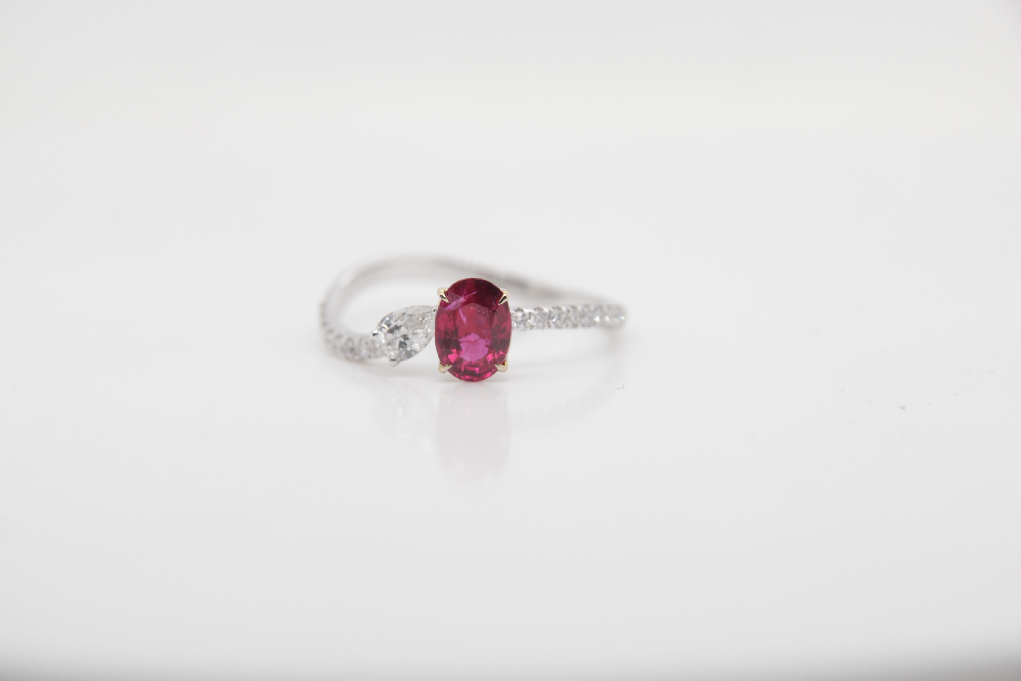 A brand new handcrafted ruby ring by Rewa Jewels. The ring's center stone is 0.70 carat Burmese ruby certified by Gem Research Swisslab (GRS) as natural, unheated, 'Pigeon blood' with the certificate number: 2022-010674. The piece has been set with
