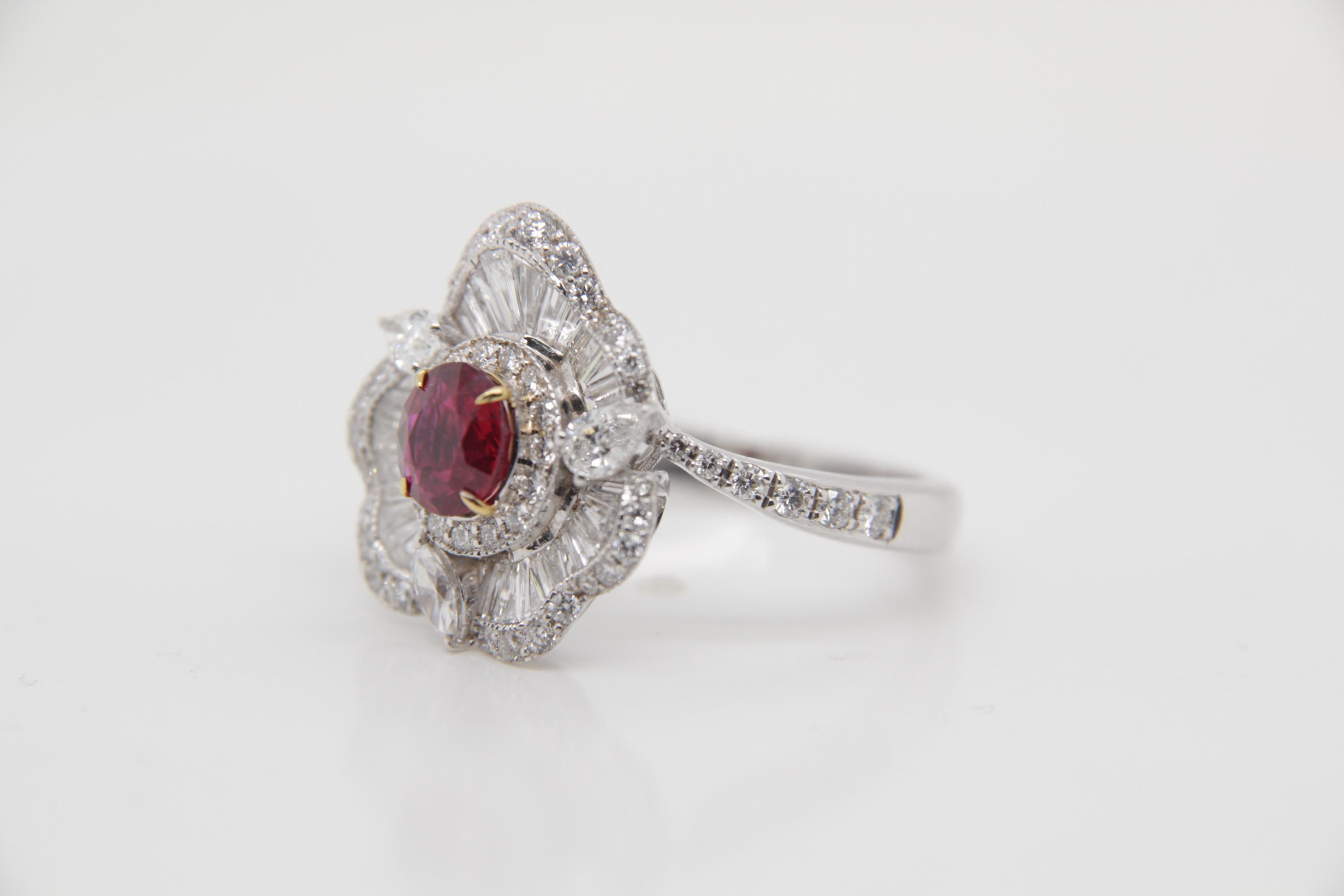 A brand new handcrafted ruby ring by Rewa Jewels. The ring's center stone is 0.89 carat Burmese ruby certified by Gem Research Swisslab (GRS) as natural, unheated, 'Pigeon blood' with the certificate number: 2021-111639. The piece has been set with