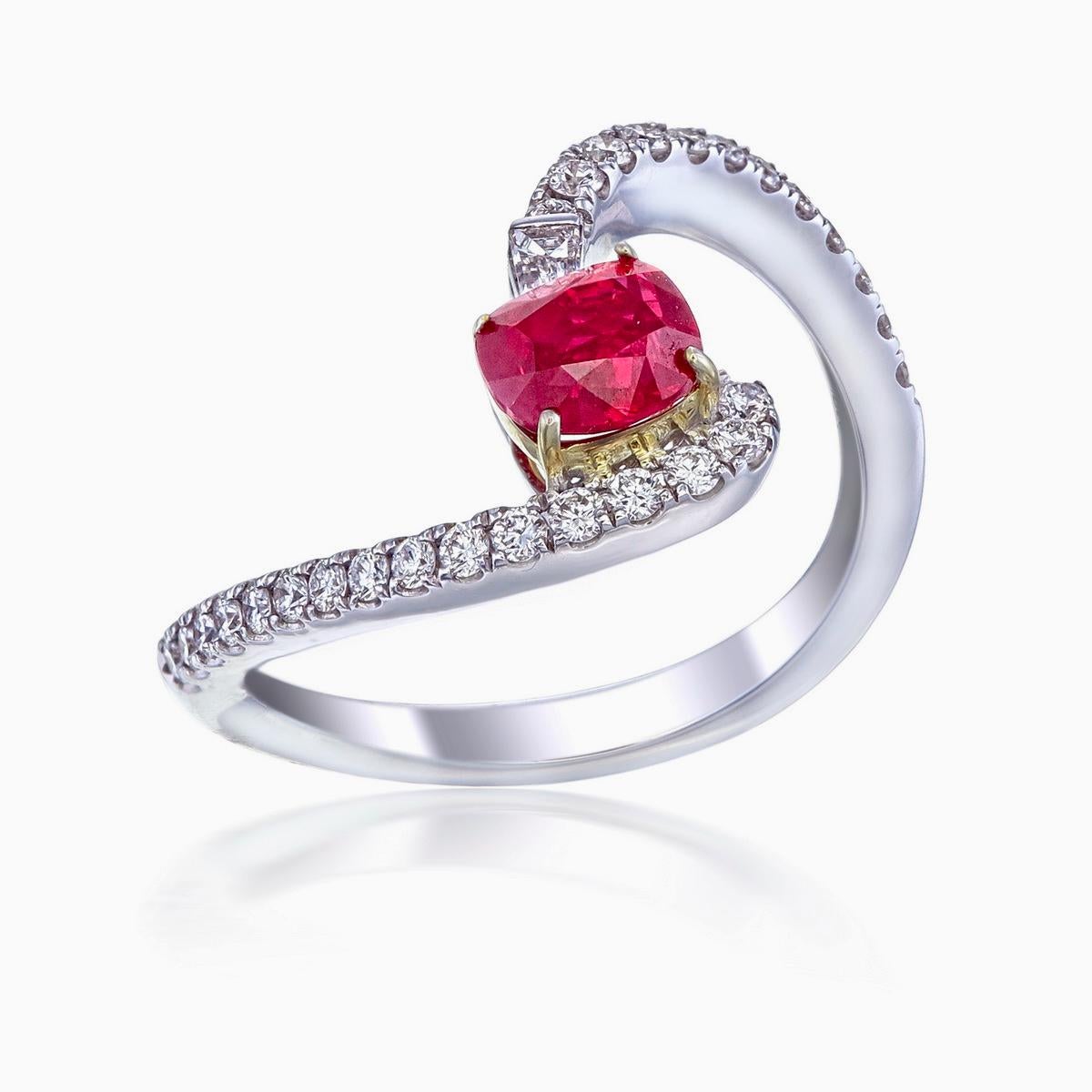 Introducing the exquisite Ruby and Diamond Ring by Rewa, a modern masterpiece that artfully blends contemporary design with timeless elegance. Inspired by nature's breathtaking beauty, this ring boasts a captivating 0.95 carat cushion-cut Burmese
