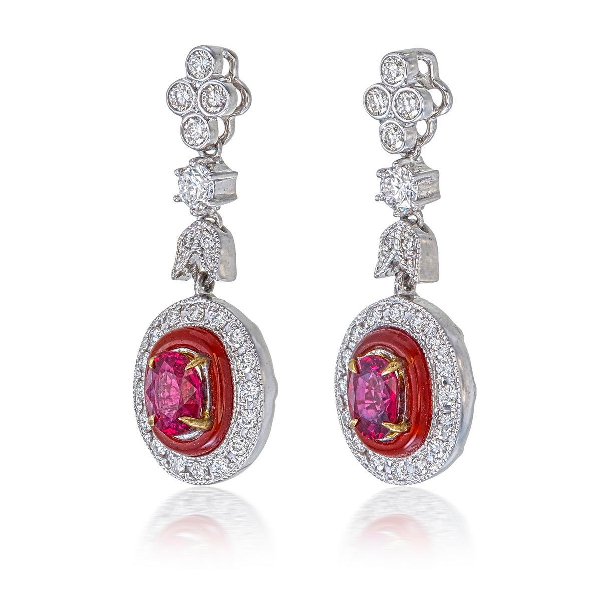 A brand new pair of ruby and diamond earrings from Rewa. The centre stones are natural rubies from Myanmar, Burma, and are certified as No Heat 'Pigeon Blood' from GemResearch Swisslab (GRS). The two rubies weigh 0.48 and 0.50 carats, a total of