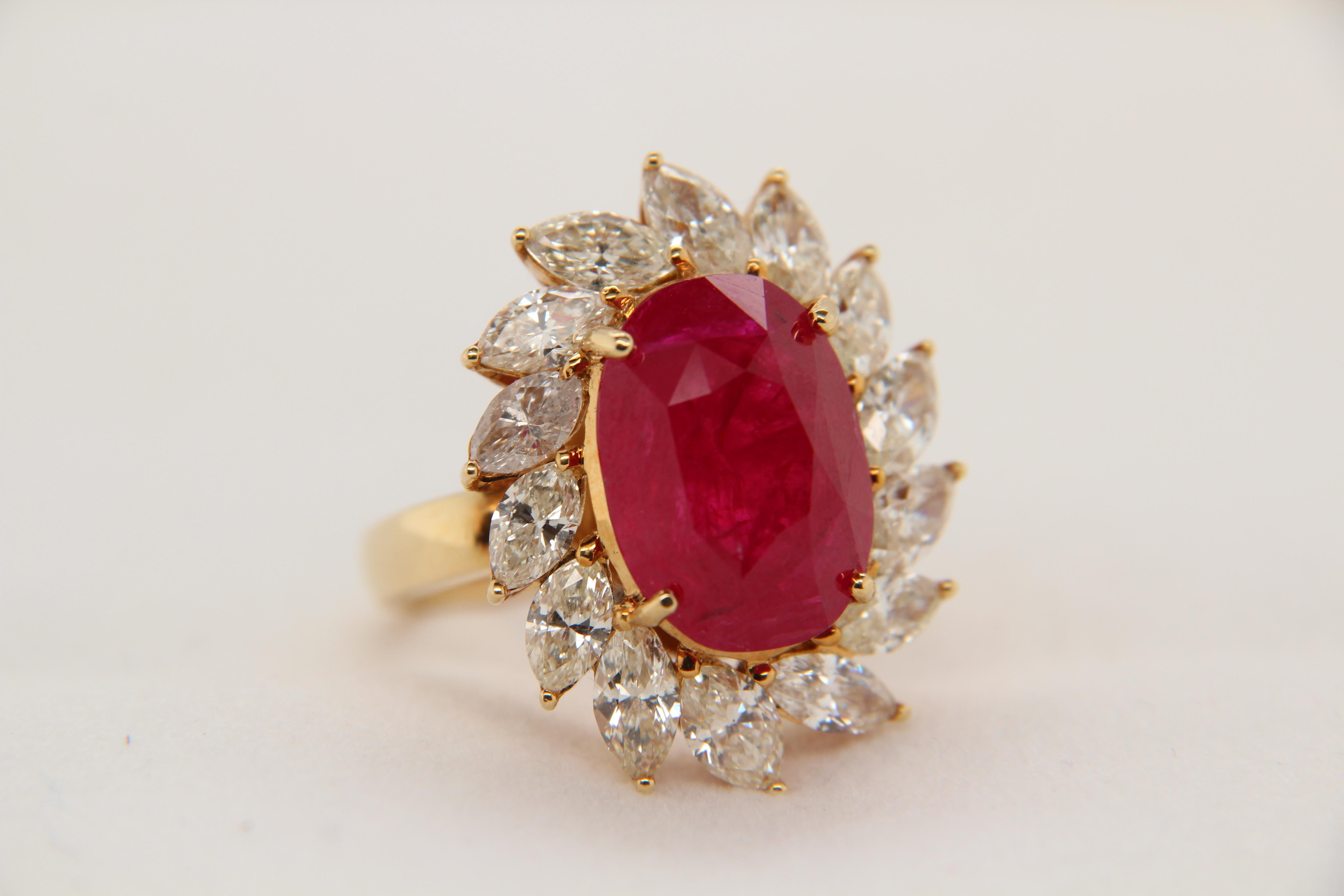 A new GRS certified 10.21 carats Red Burmese heated ring with diamond accent stones weighing at 4.50 carats. The ruby is set in a 18 Karat mounting and the whole ring weighs about 12.35 grams.