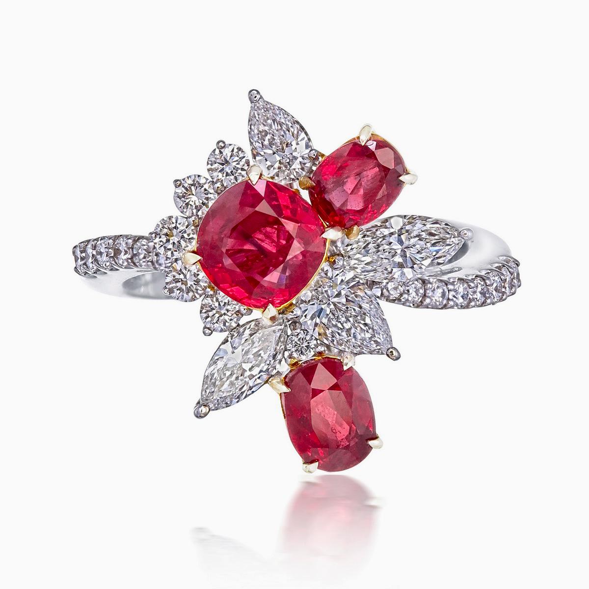 A brand new handcrafted ruby ring by Rewa Jewels. The ring's center stone is 1.05 carat Burmese ruby certified by Gem Research Swisslab (GRS) as natural, unheated, 'Pigeon blood' with the certificate number: 2020-082668. The other two rubies have