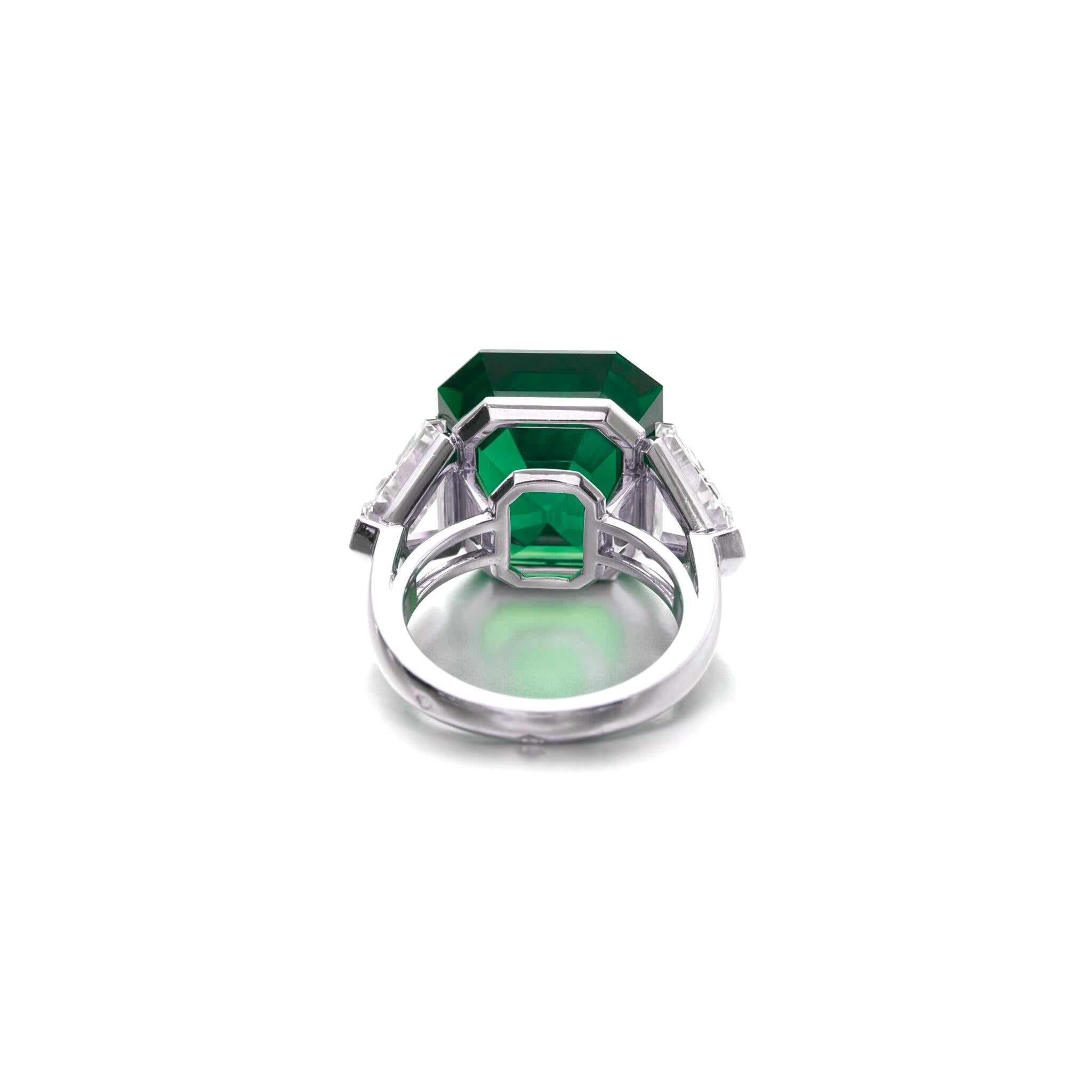 Introducing a truly extraordinary piece of fine jewelry: the GRS Certified 11.21 Carat vivid green emerald Diamond Ring.

Immerse yourself in the captivating allure of this exquisite ring, featuring a stunning 11.21 carat vivid green emerald of