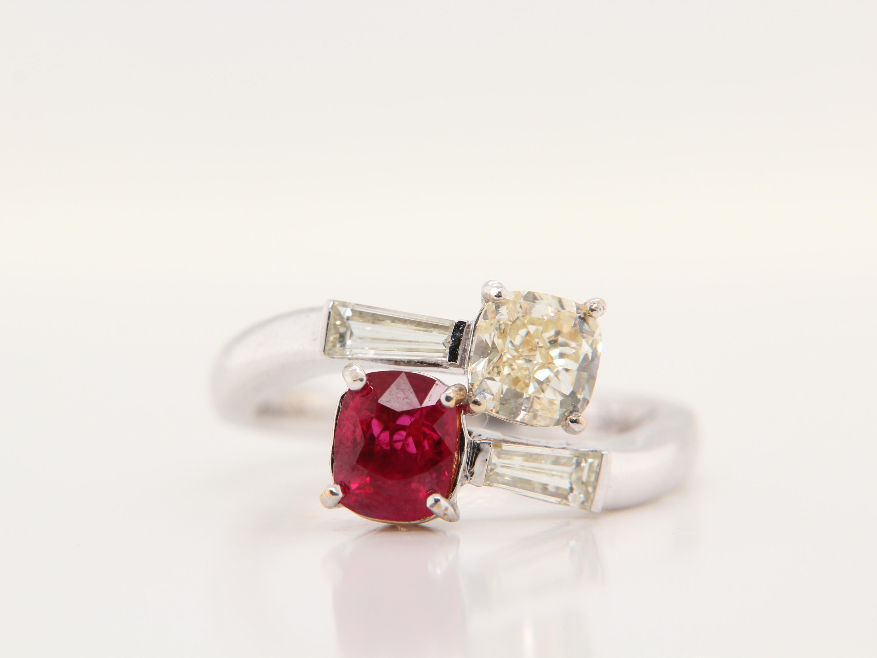 A brand new modern themed Burmese ruby and diamond ring. The combination of the sparkling 1.15ct diamond compliments the lustrous ruby helps the ring  to be very eye catching.  The ruby weighs 1.13 carat and is certified by Gem Research Swisslab