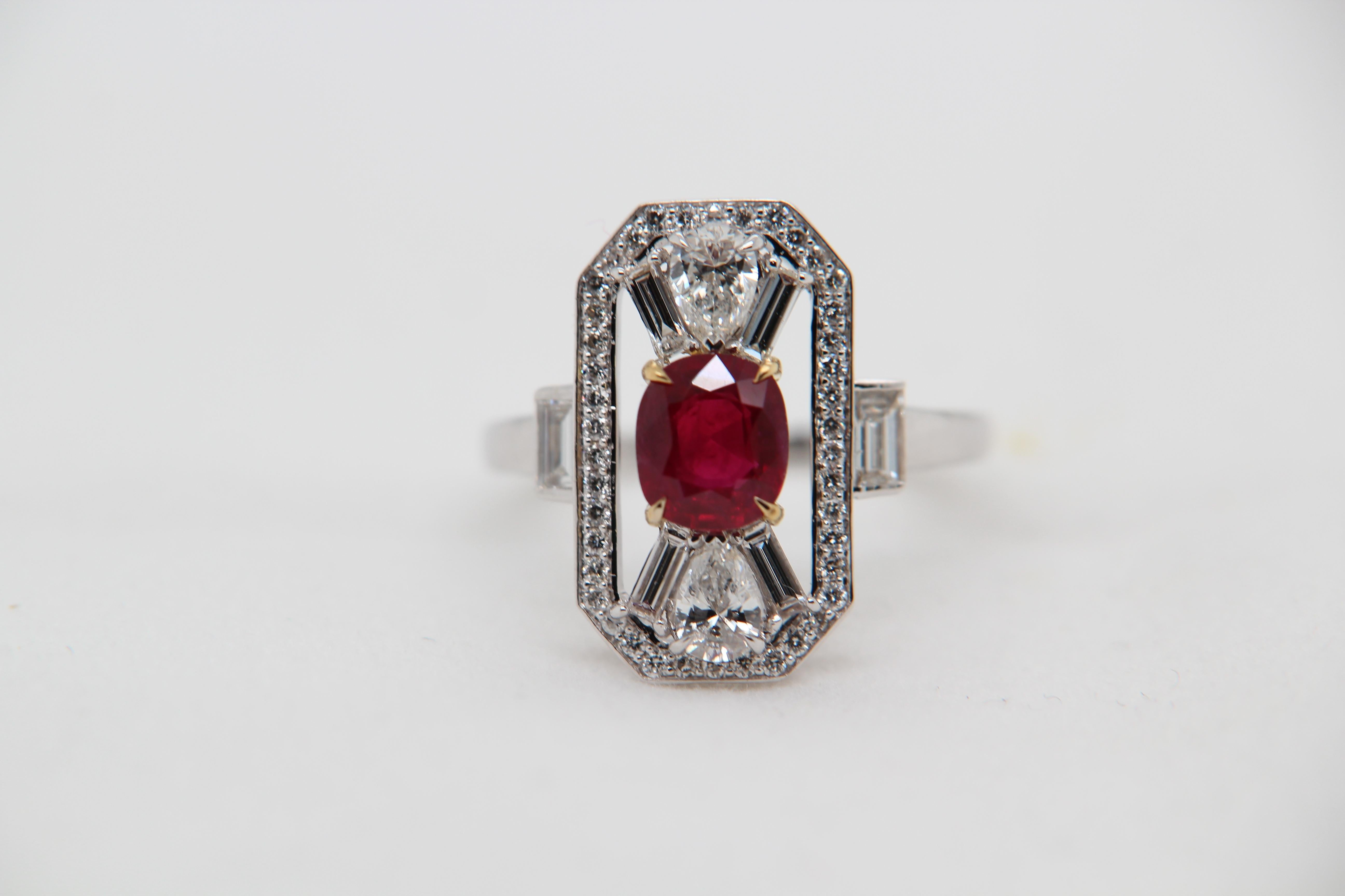 A new 1.16 carat Burmese ruby ring mounted with diamonds in 18 Karat gold. The ruby weighs 1.16 carat and is certified by Gem Research Swisslab (GRS) as natural, no heat, and 'Vivid Red Pigeon's Blood'. The total diamond weight is 1.05 carat and the