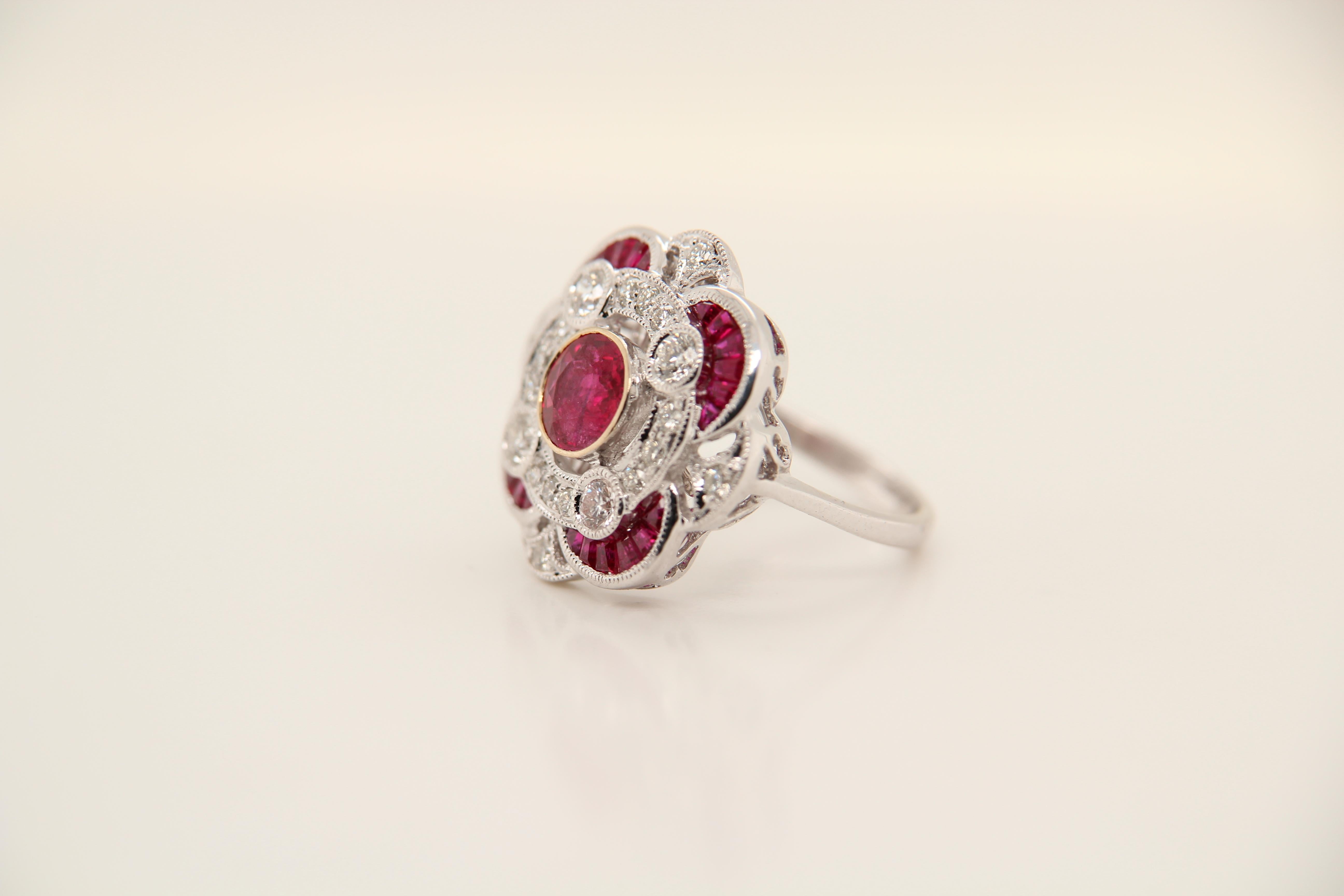 A ruby diamond ring. The center stone ruby is 1.19 Carat from Burma as certified by GRS surrounded by 0.68 Carat tapered shaped rubies and 0.65 Carat round shaped diamonds.  The ring can be resized.