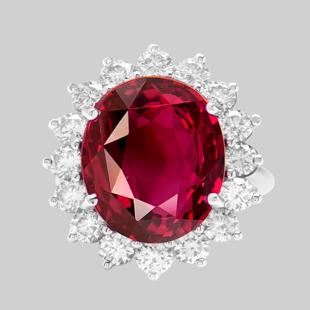 A truly magnificent classic ring. The oval shaped BURMESE ruby center stone is surrounded by round diamonds in a handmade platinum setting
Ruby total weight 12 carats
Diamond total weight 1 carats
Ring size 7 sizing options are available
Appraisal