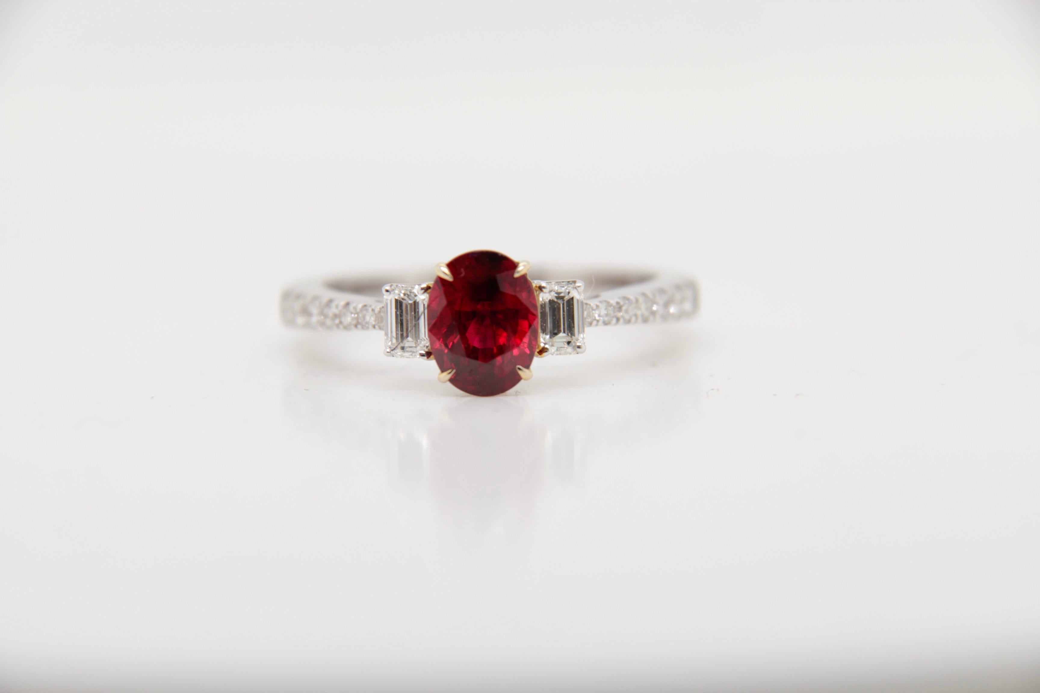 A brand new ruby ring. The ring's center stone is 1.25 carat Burmese ruby certified by Gem Research Swisslab (GRS) as natural, unheated, 'Pigeon blood'. The stone was unearthed from Burma - one of the oldest ruby mines in the world. The ruby has a