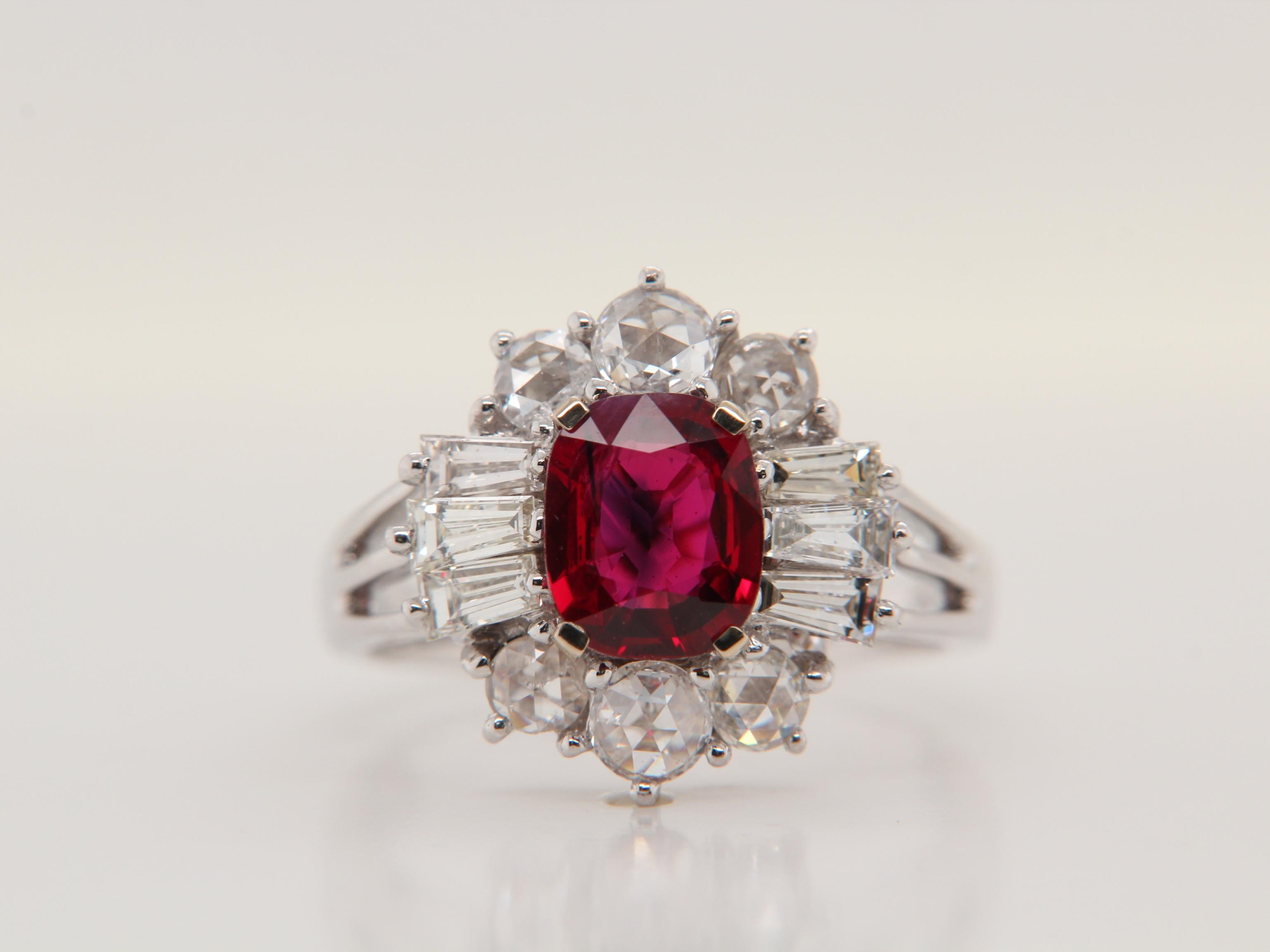 A brand new Burmese ruby and diamond ring by Rewa Jewelry. The mounting is handmade in 18 Karat white gold and set with a 1.38 Carat ruby in the center. The ruby is certified by Gem Research Swisslab as natural, 'Pigeon Blood', and without any heat