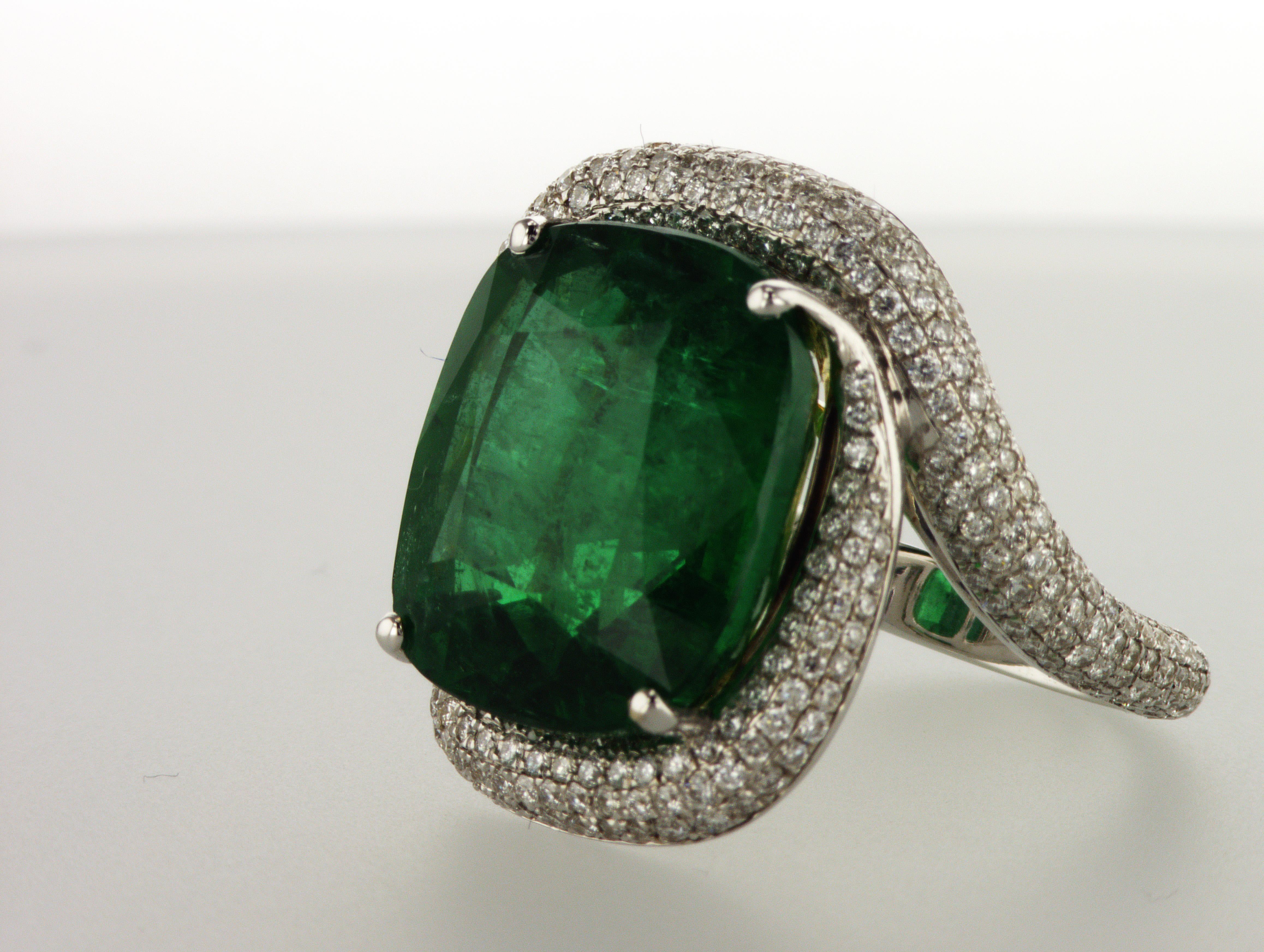 18K Diamond Ring with 13.98 ct Cushion Vivid Green Zambian Emerald and 1.41 ct Diamonds. This World Class magnificent Zambian Emerald can attract the attention of any person. Certified by GRS Lab with special report that you can view in video file