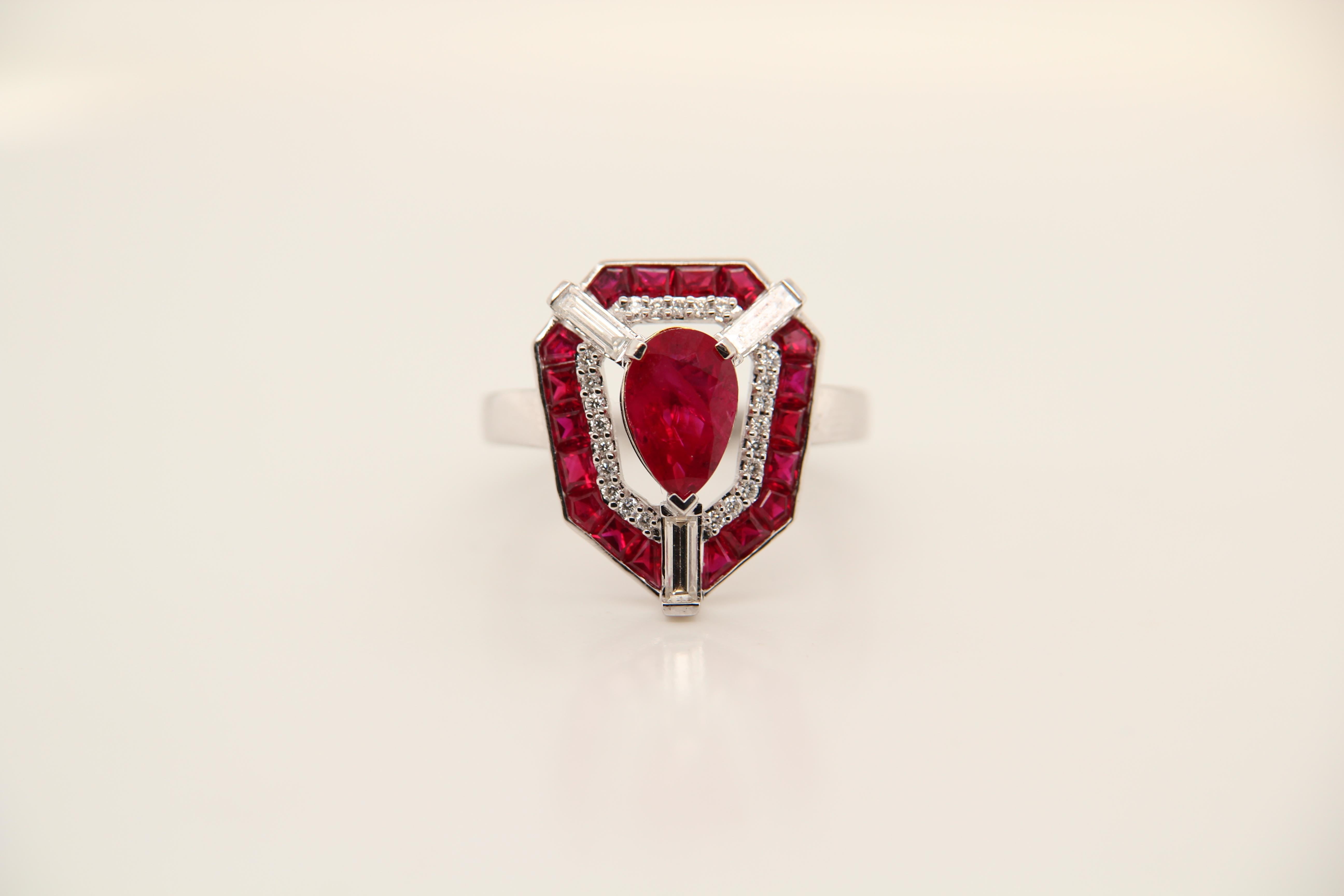 A Ruby and diamond ring. The ring's center stone is 1.40 carat pigeon blood Burmese ruby certified by GRS. The center stone is surrounded by 1.14 carat princess shaped rubies and 0.48 carat bugget. The ring can be resized.